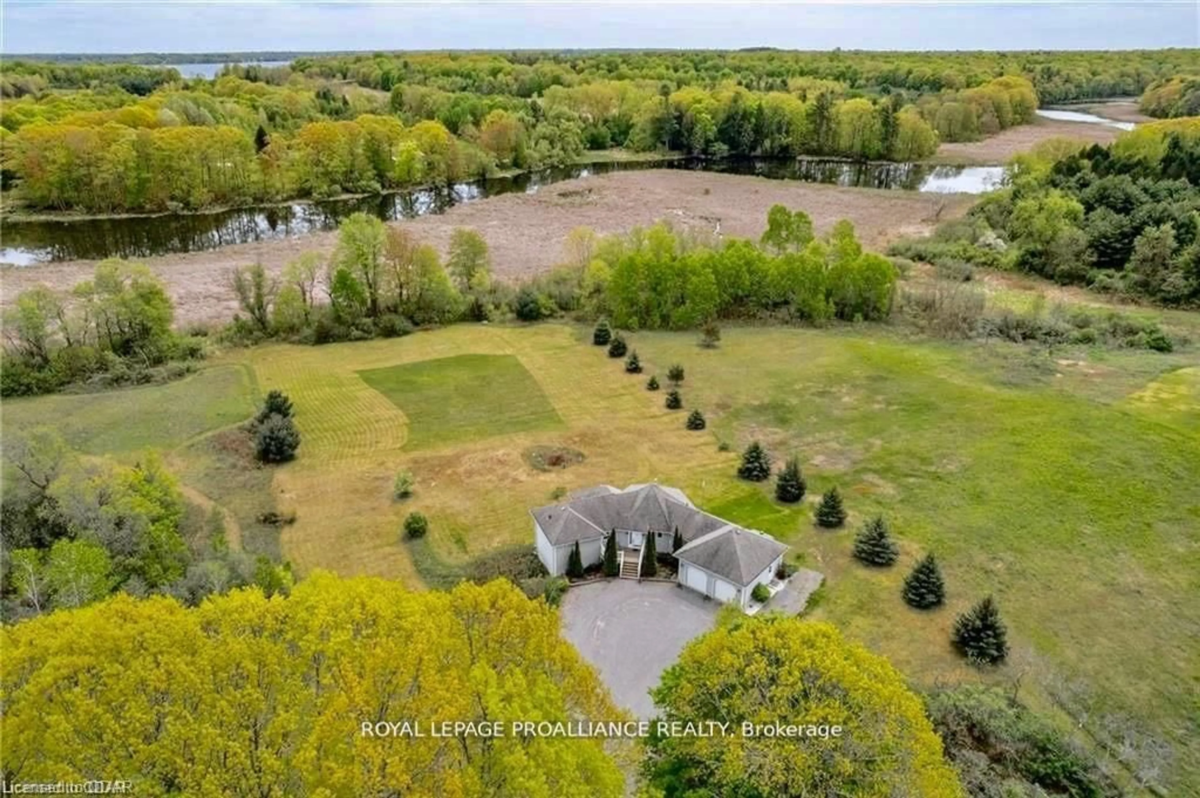 A pic from exterior of the house or condo, the fenced backyard for 66 Storms Rd, Prince Edward County Ontario K0K 2P0