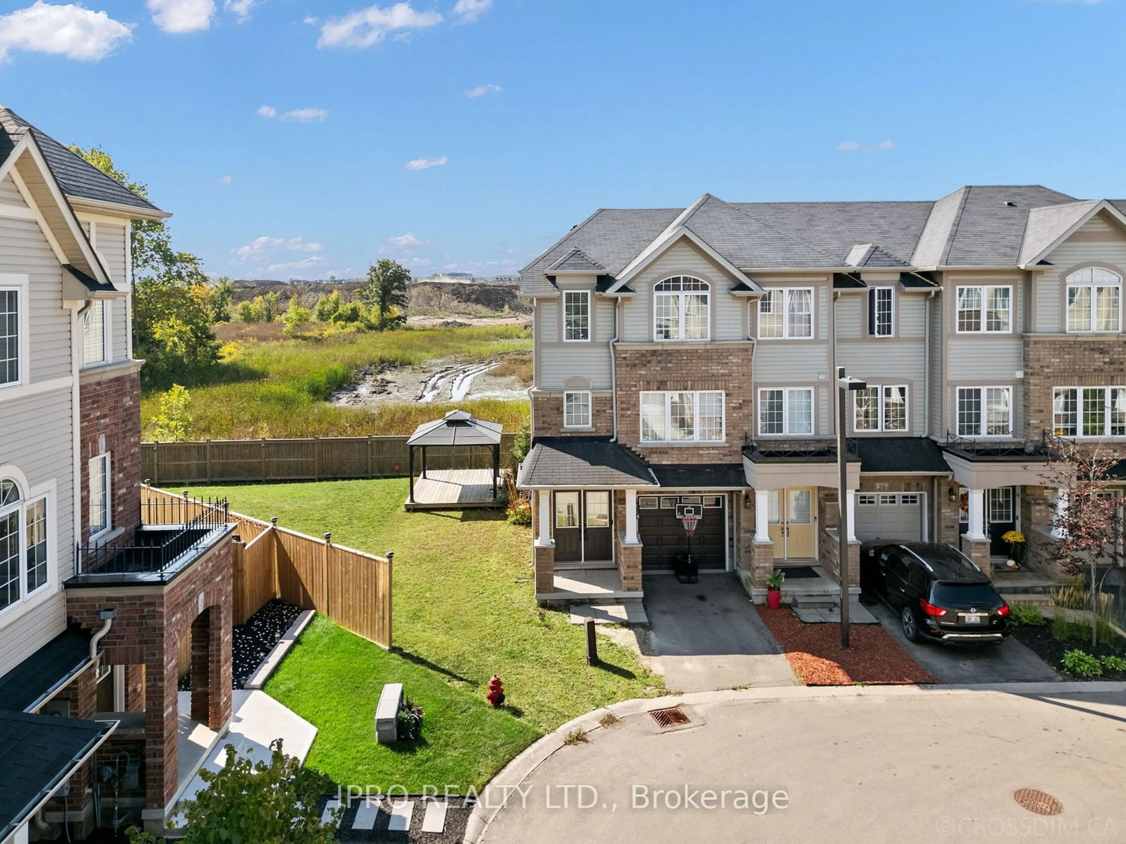 A pic from exterior of the house or condo, the fenced backyard for 27 Mayland Tr, Hamilton Ontario L8J 0G4