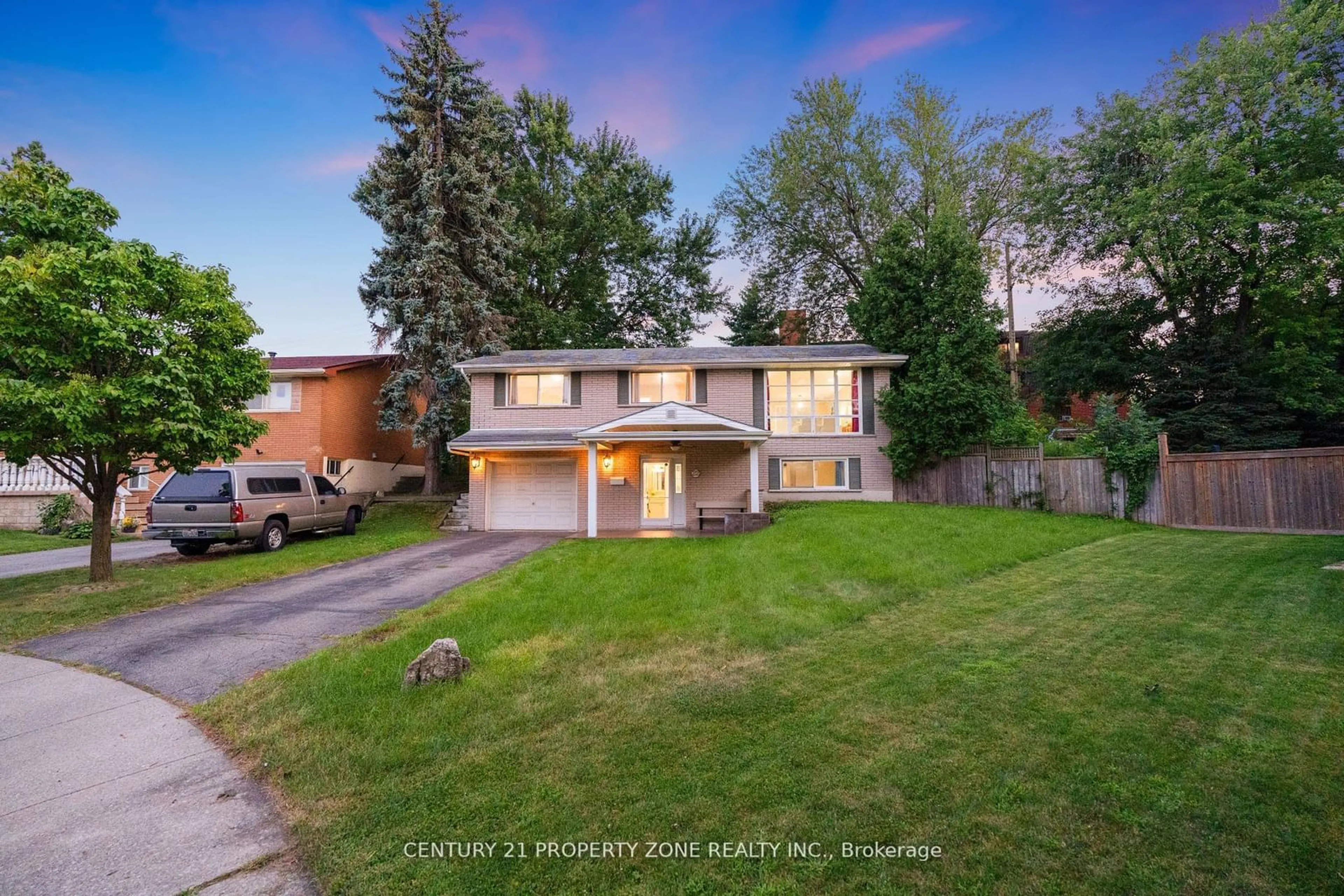 Frontside or backside of a home, the fenced backyard for 22 colonial Crt, Hamilton Ontario L8K 4H3