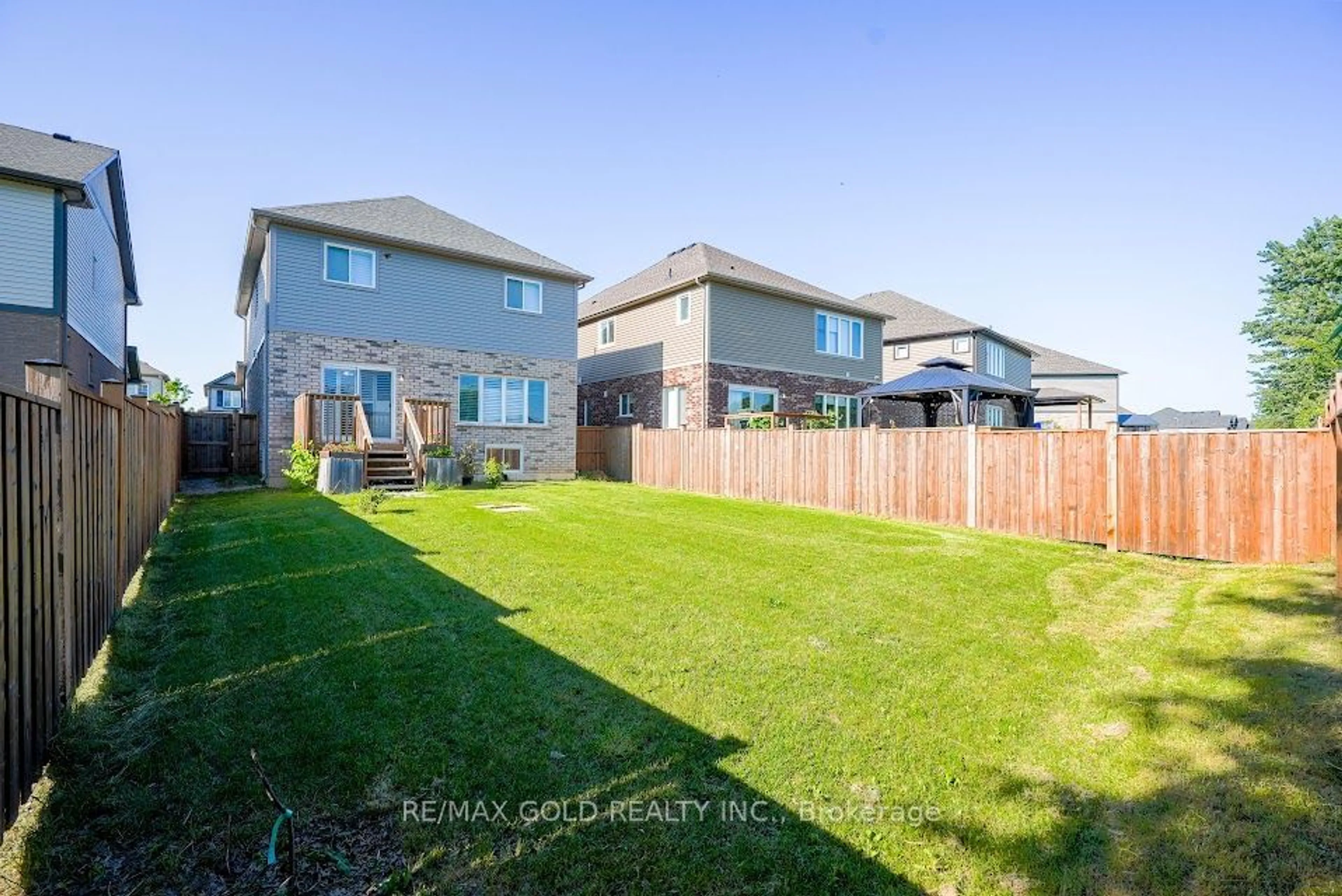 Frontside or backside of a home, the fenced backyard for 83 Monarch St, Welland Ontario L3C 0E6