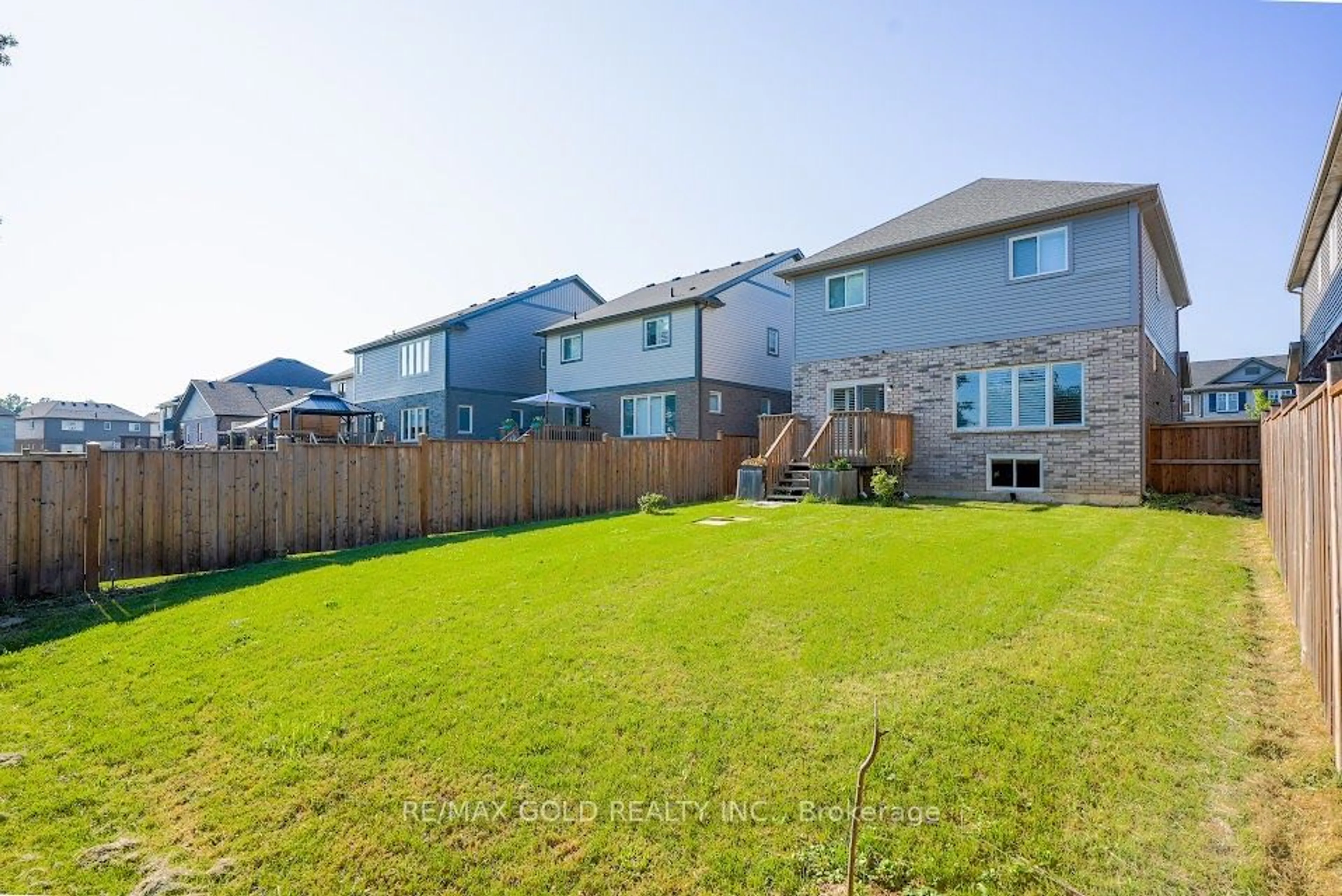 Frontside or backside of a home, the fenced backyard for 83 Monarch St, Welland Ontario L3C 0E6