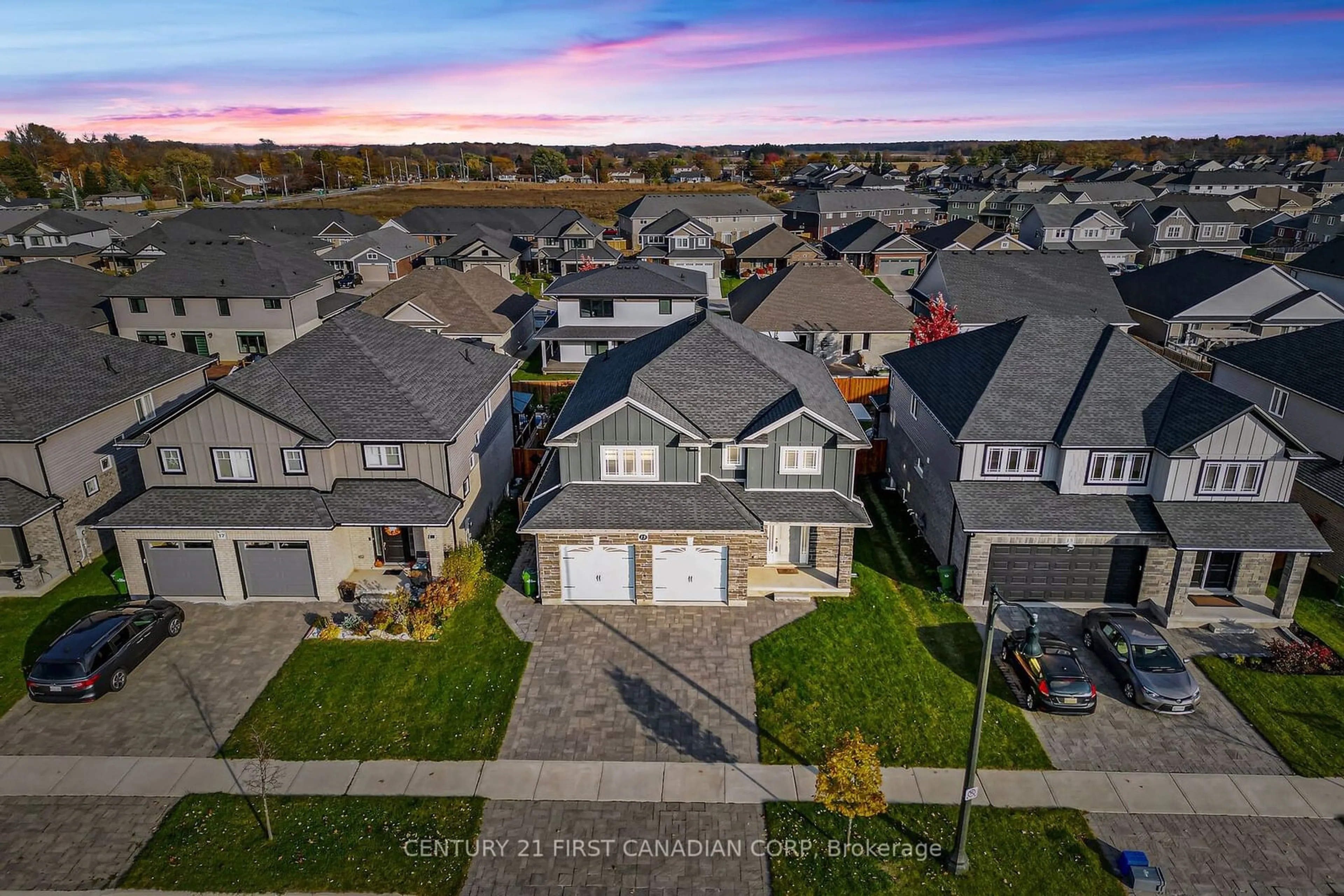 Frontside or backside of a home, the fenced backyard for 15 Honey Bend, St. Thomas Ontario N5P 3S6