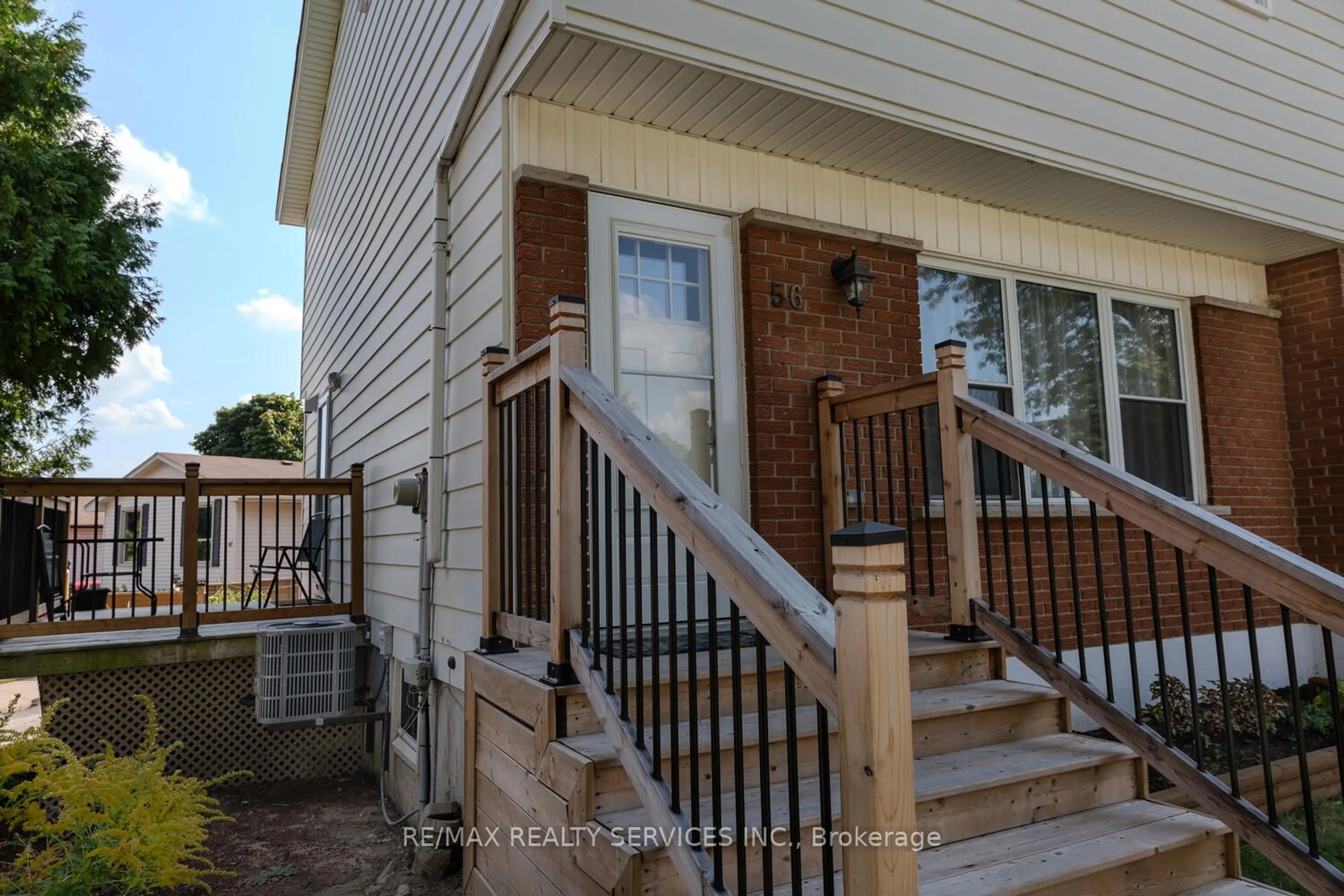 A pic from exterior of the house or condo, the fenced backyard for 56 Raleigh Crt, Hamilton Ontario L8W 1H1