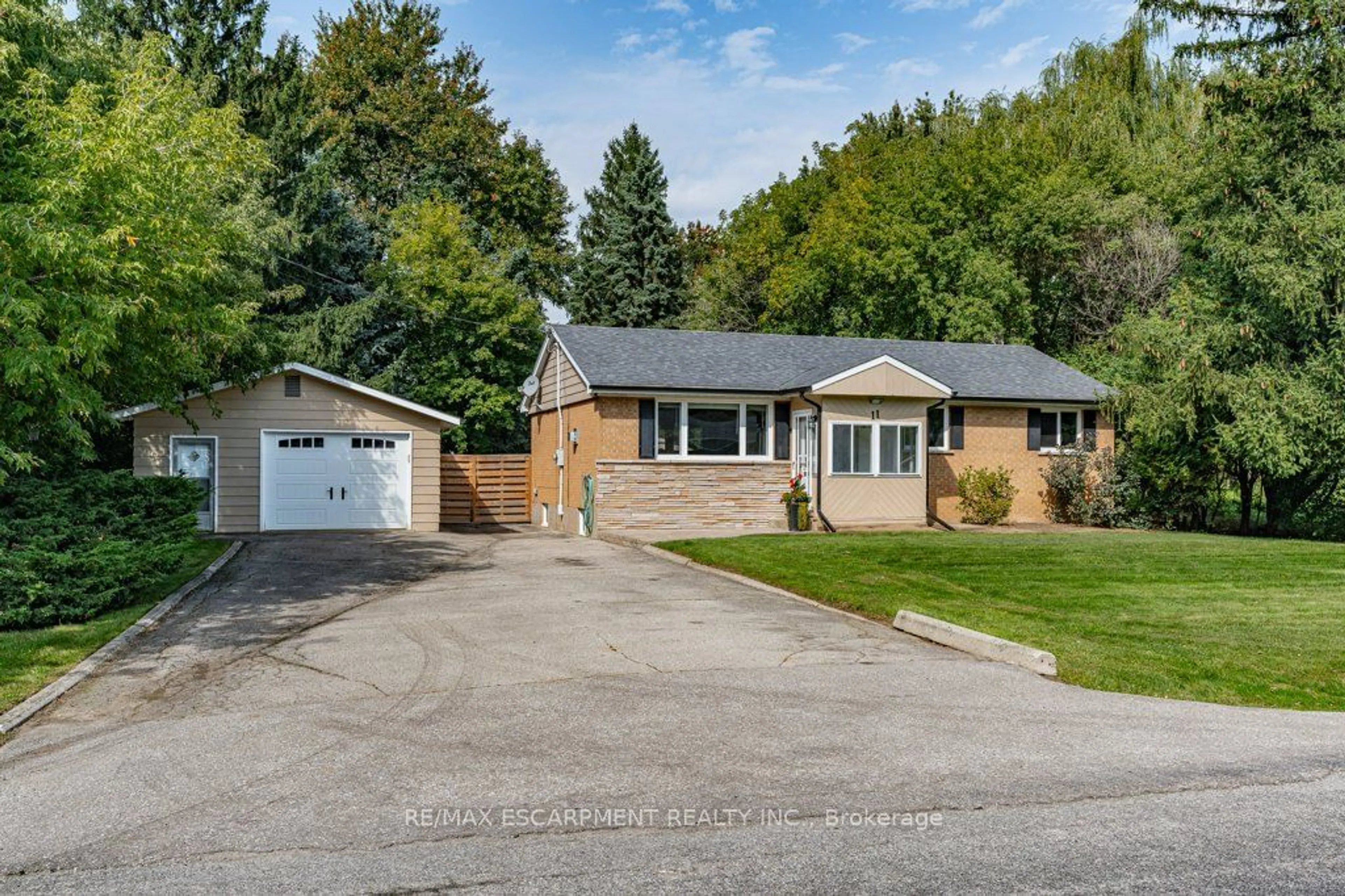 Frontside or backside of a home, cottage for 11 Garwood Ave, Hamilton Ontario L9H 7J8