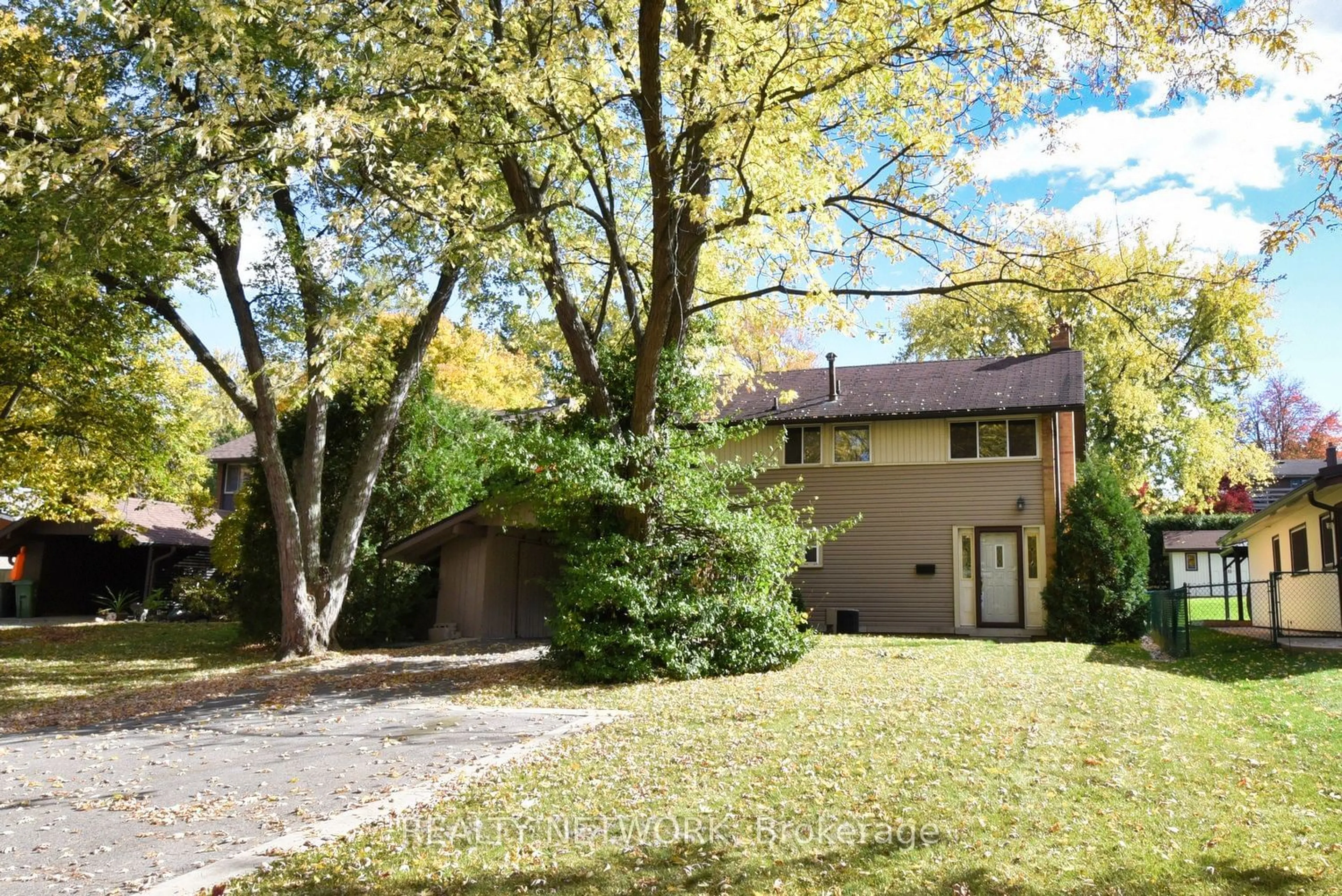 Frontside or backside of a home, the fenced backyard for 18 Pleasant Ave, Hamilton Ontario L9H 3S7