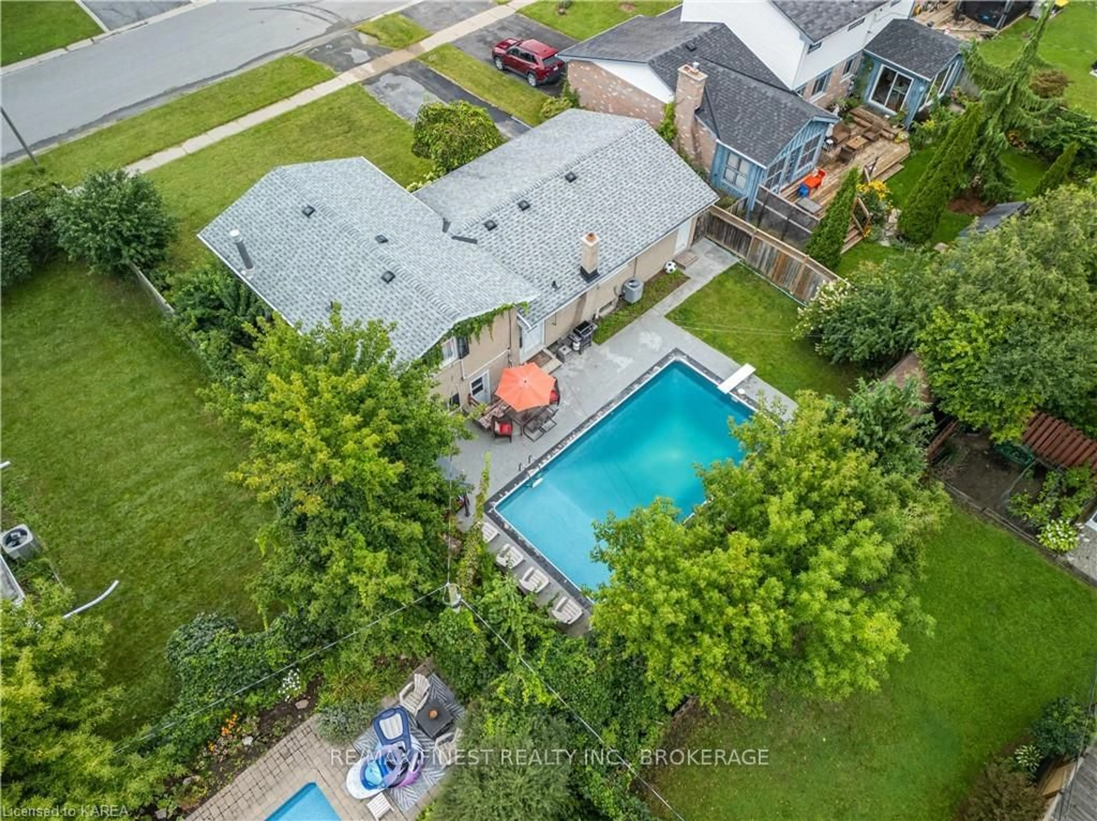 Frontside or backside of a home, the fenced backyard for 784 Downing St, Kingston Ontario K7M 5N2