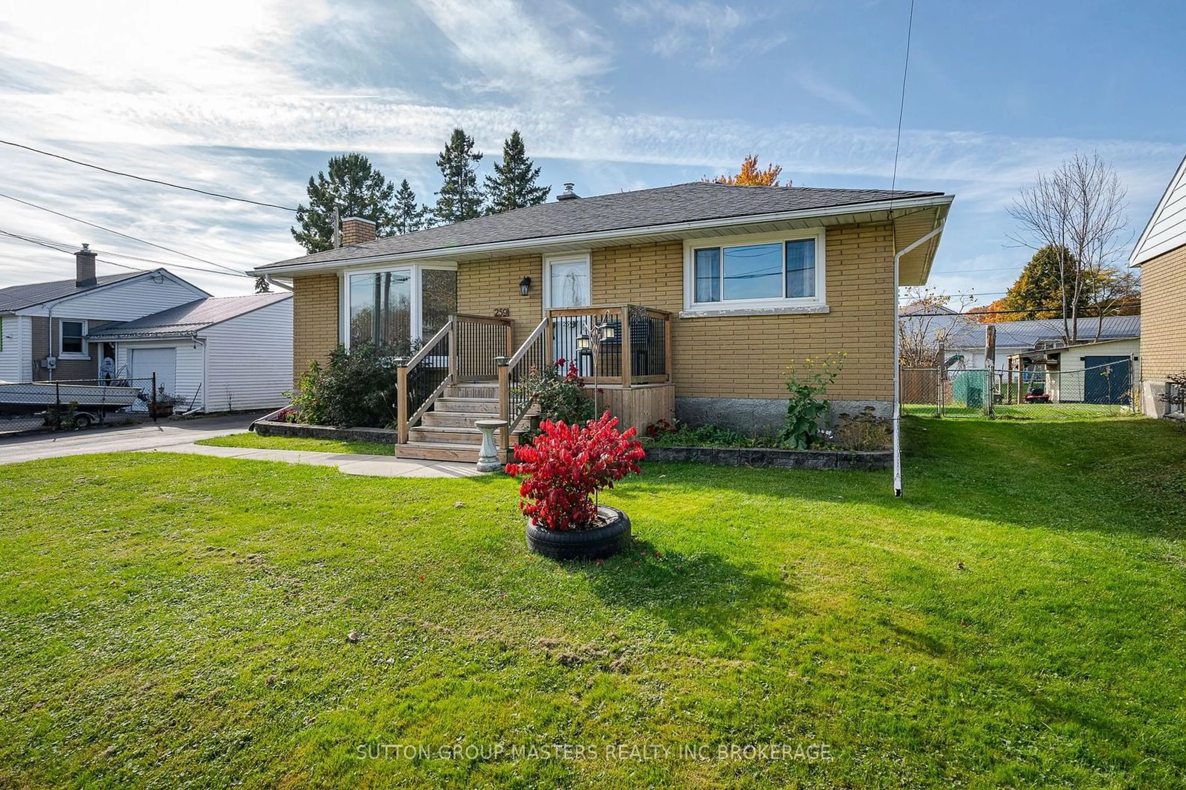 Frontside or backside of a home, the fenced backyard for 259 McEwen Dr, Kingston Ontario K7M 3W2