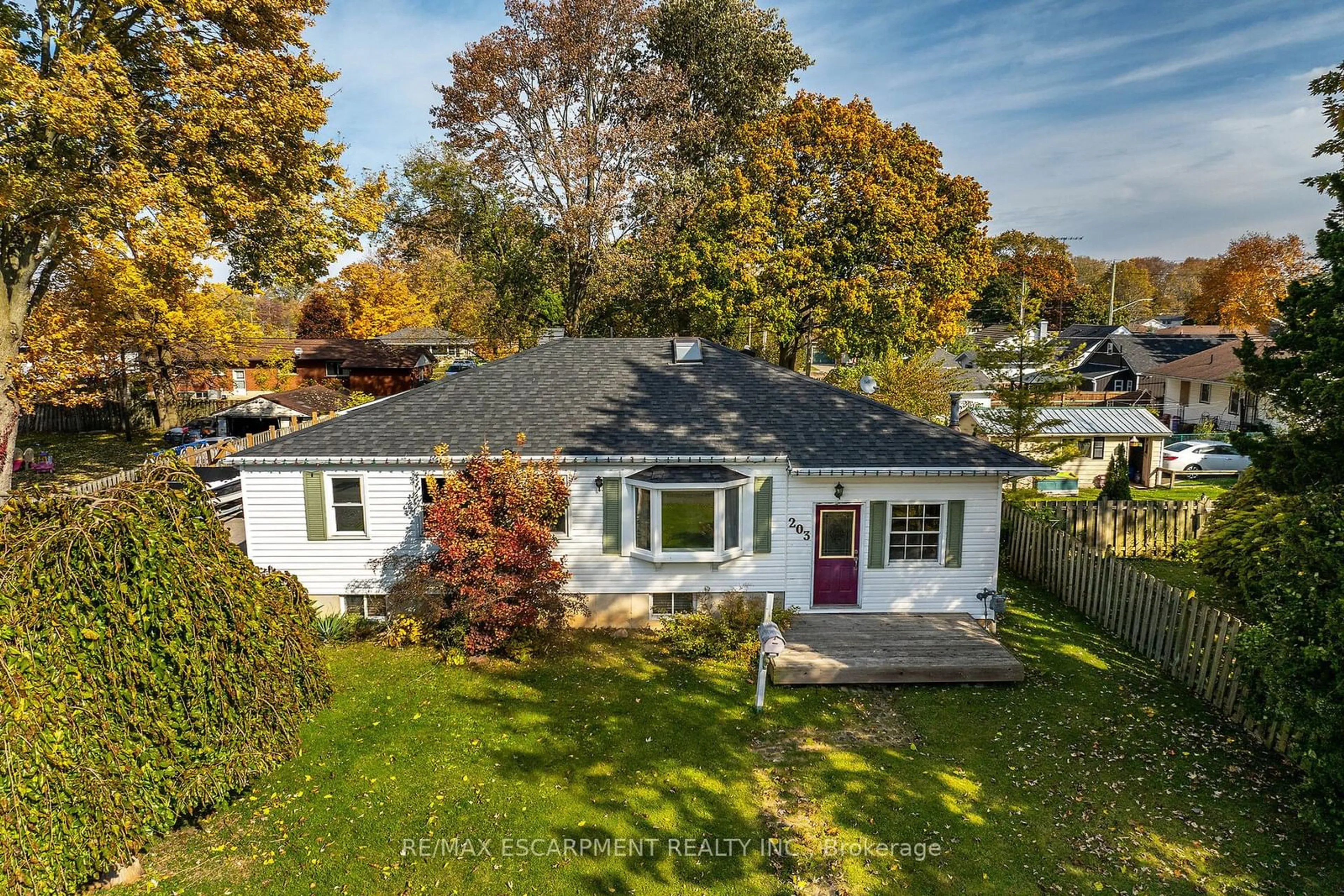 Frontside or backside of a home, the fenced backyard for 203 Park Ave, Haldimand Ontario N1A 1M7