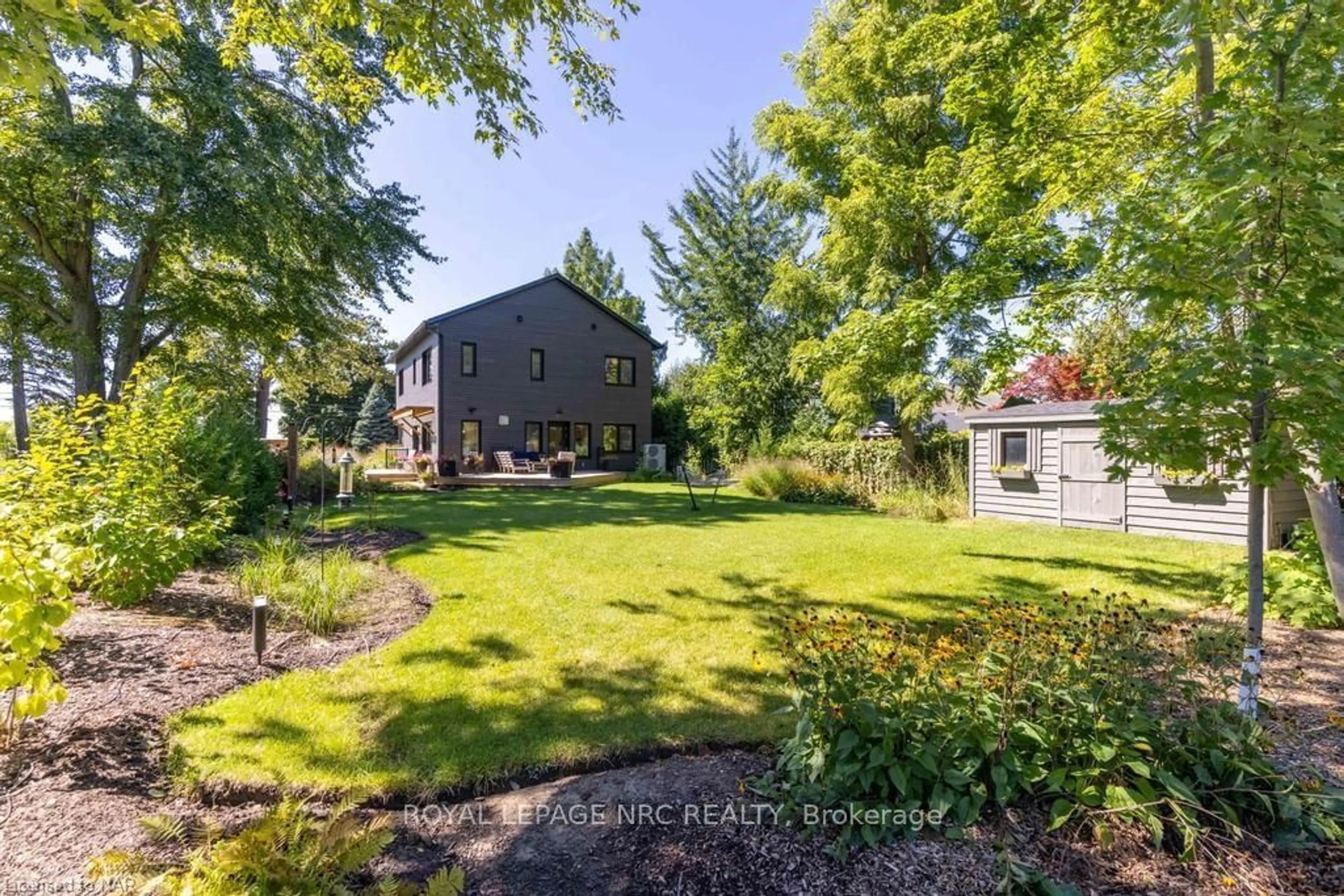 A pic from exterior of the house or condo, the fenced backyard for 69 NIAGARA St, Niagara-on-the-Lake Ontario L0S 1J0