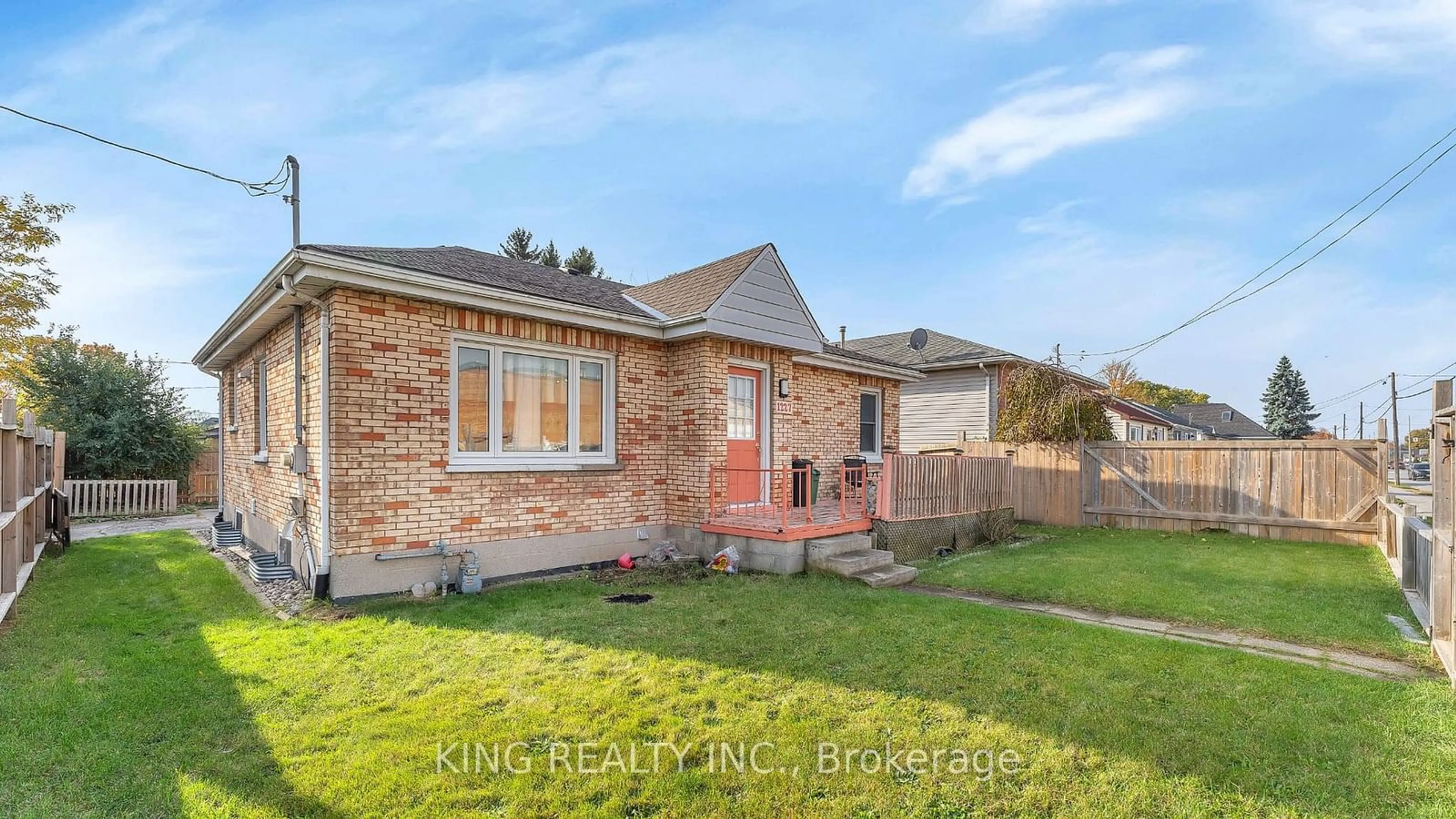 Frontside or backside of a home, the fenced backyard for 1227 TRAFALGAR St, London Ontario N5Z 1H6