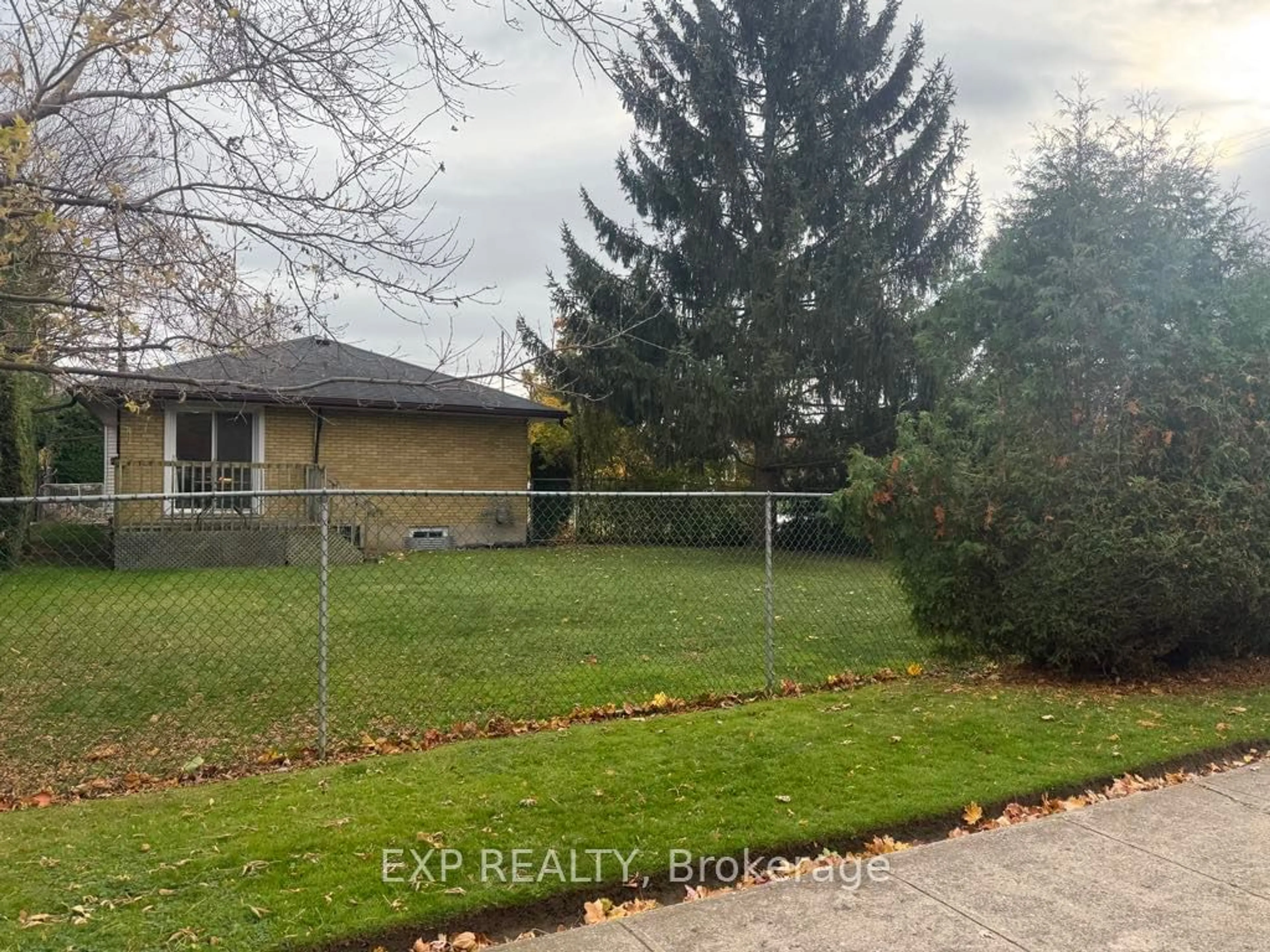 Frontside or backside of a home, the fenced backyard for 164 Atkinson Blvd, London Ontario N5W 4Z4