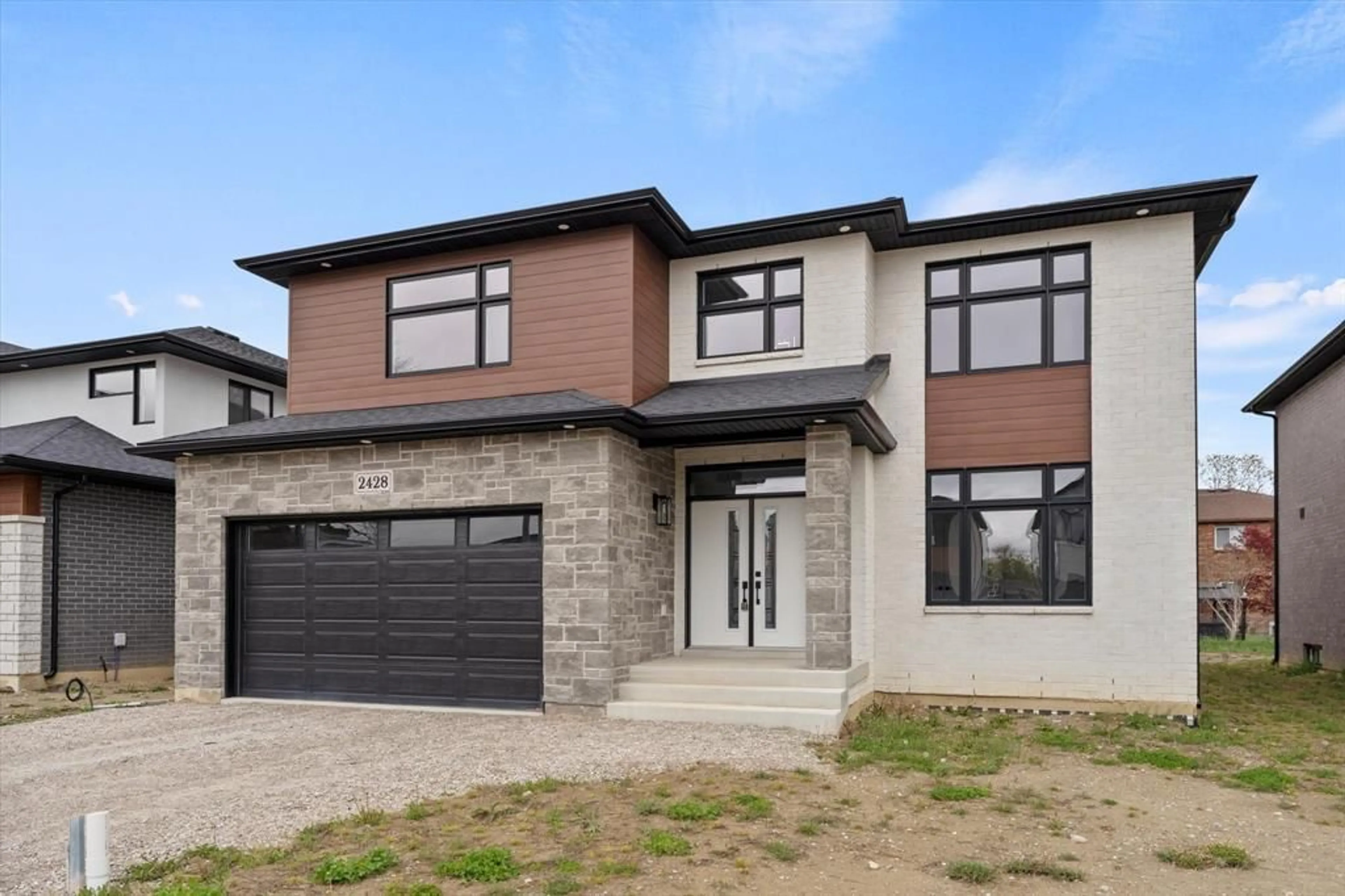 Home with brick exterior material for 2428 Roxborough, Windsor Ontario N9E 2Z8