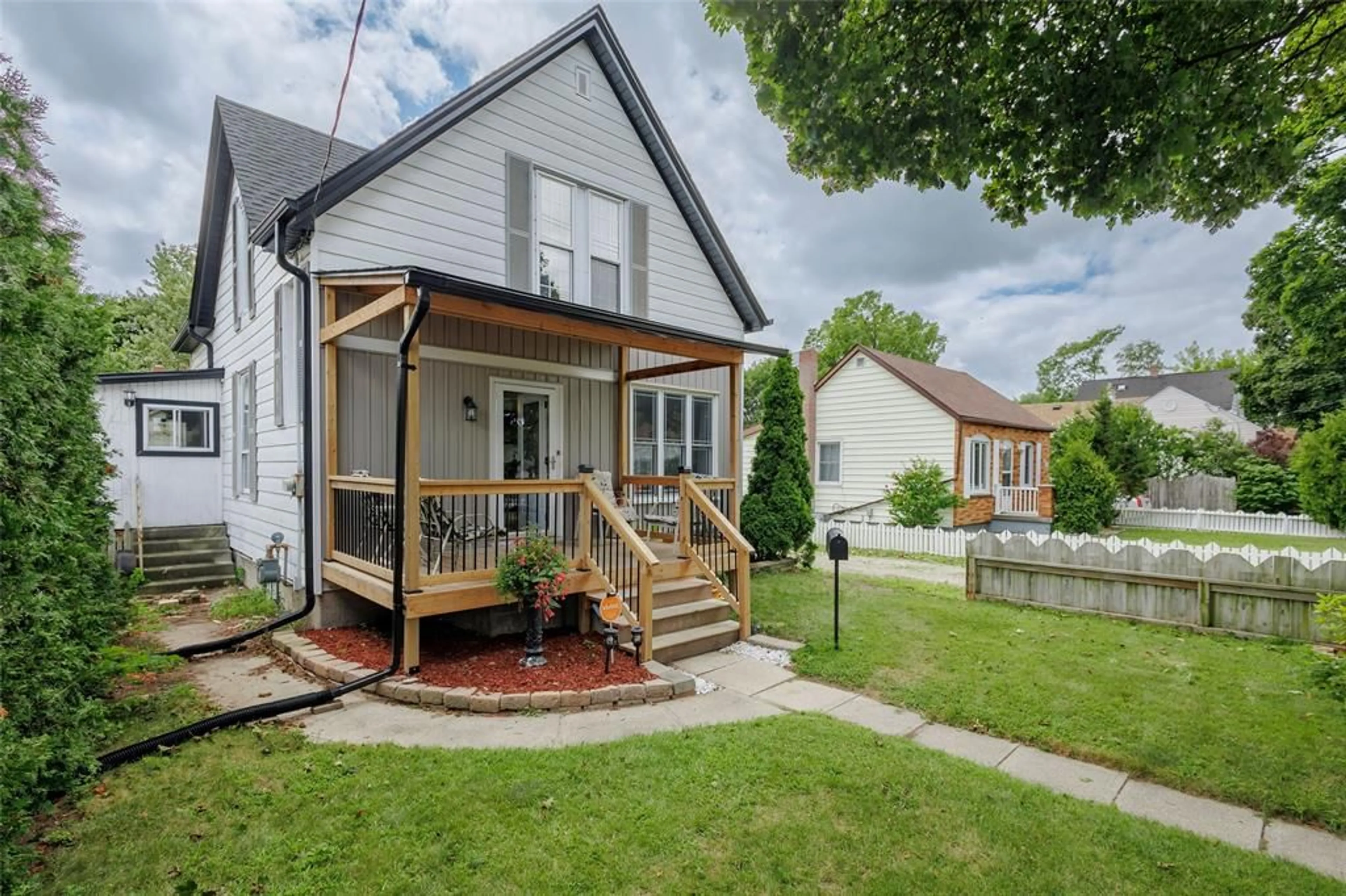 Frontside or backside of a home, the fenced backyard for 379 MAXWELL St, Sarnia Ontario N7S2Y2