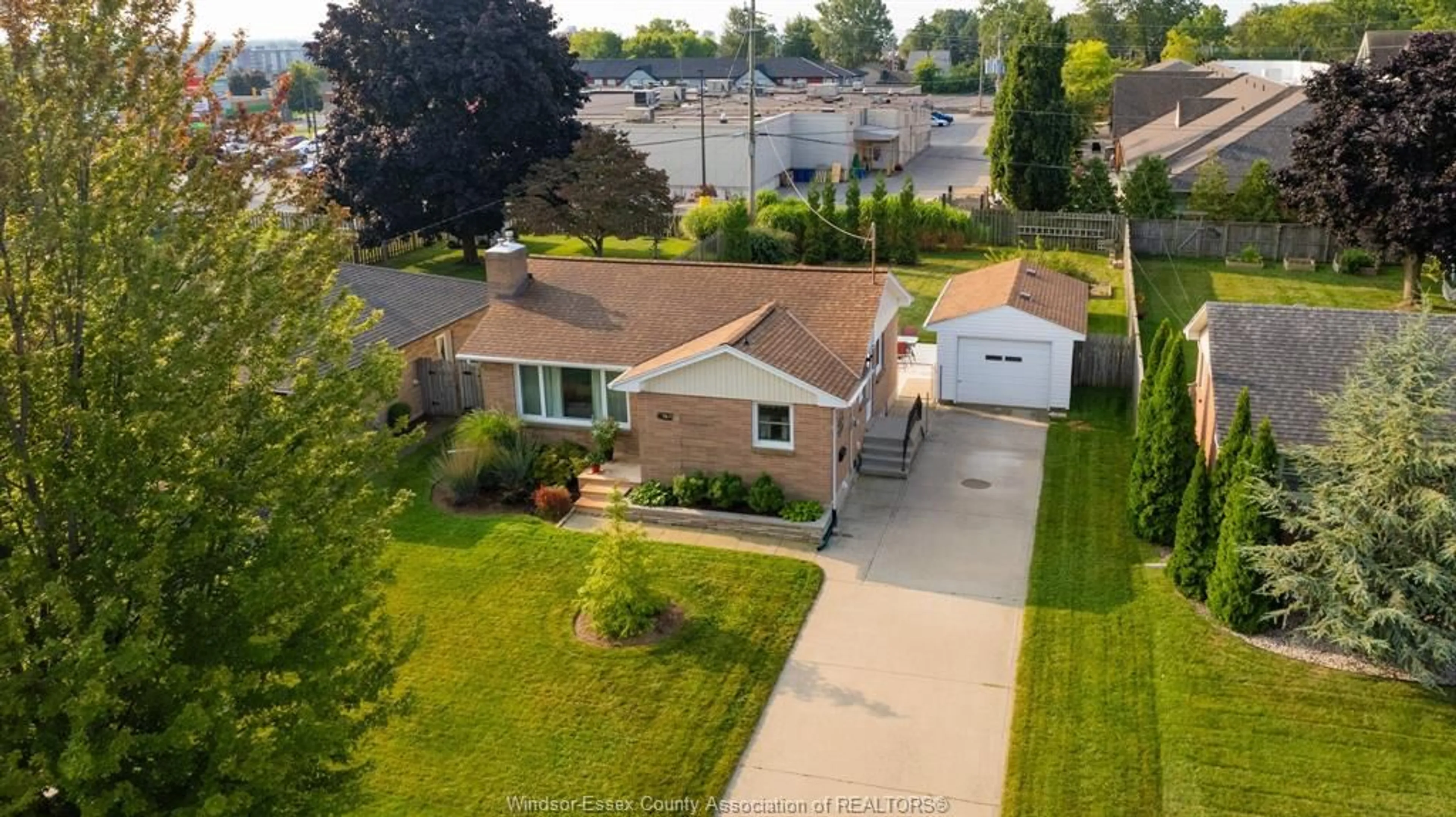 Frontside or backside of a home, the fenced backyard for 12 PULFORD Ave, Leamington Ontario N8H 2J3