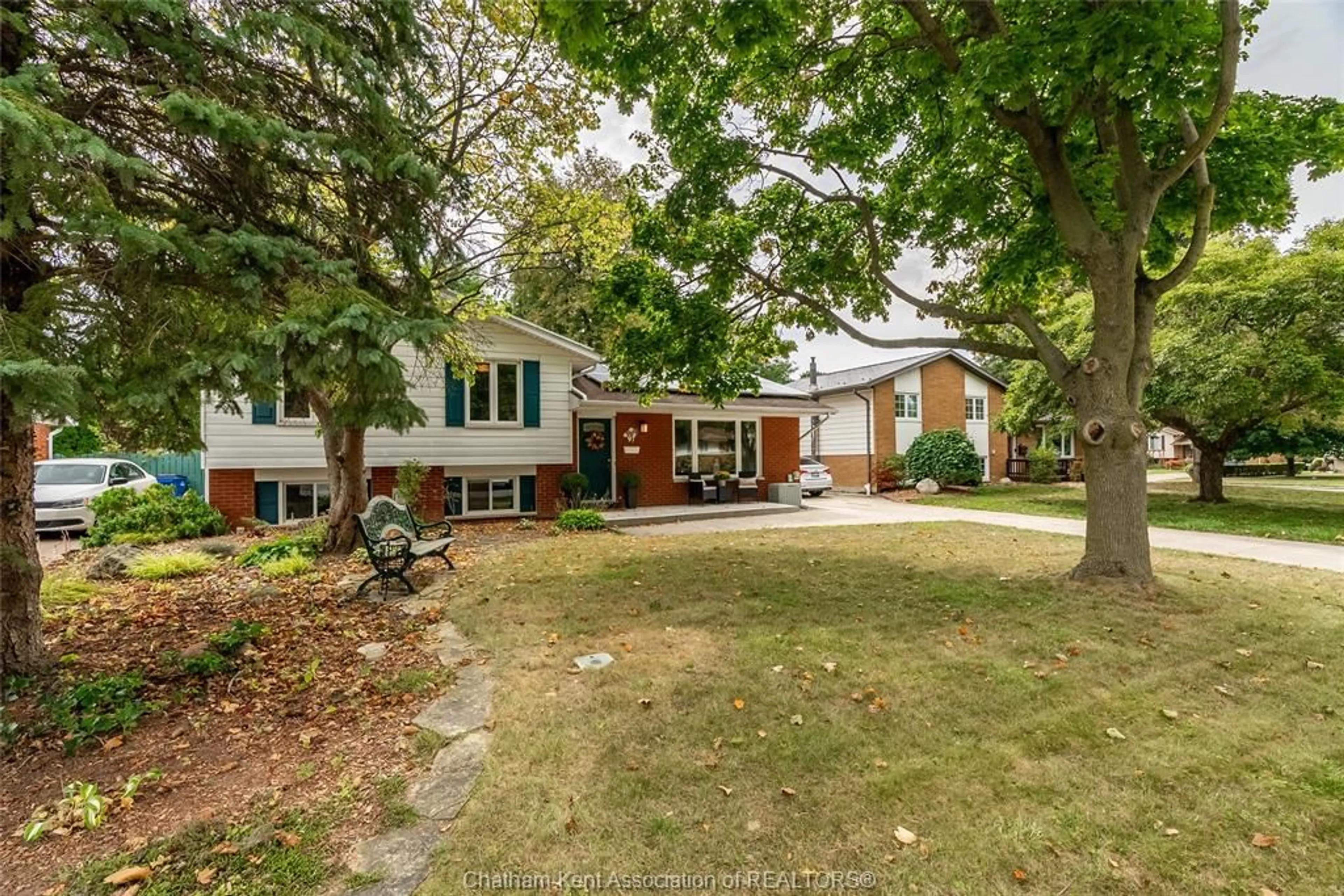 Frontside or backside of a home, the fenced backyard for 97 Partridge Cres, Chatham Ontario N7L 1E8