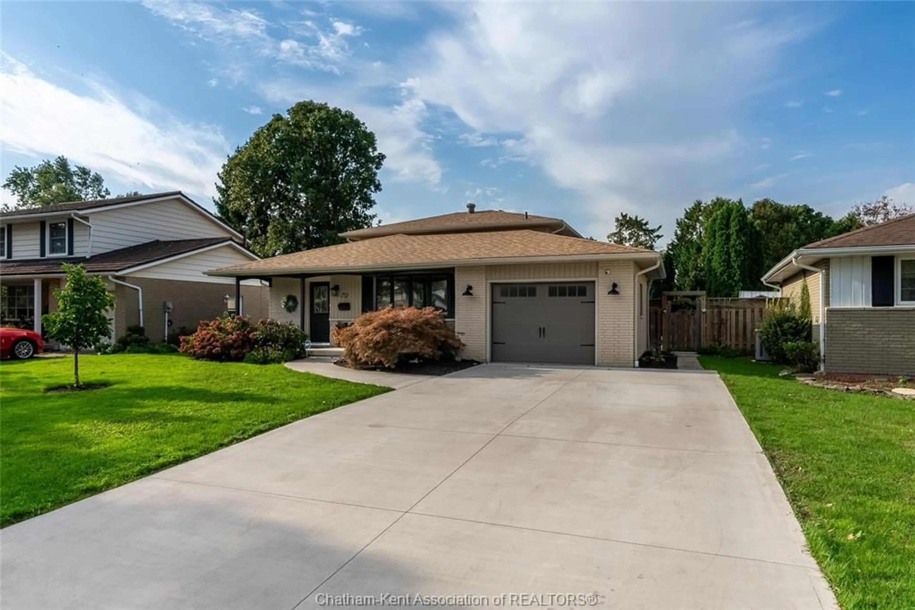 Frontside or backside of a home, the fenced backyard for 70 Northland Dr, Chatham Ontario N7L3Y2