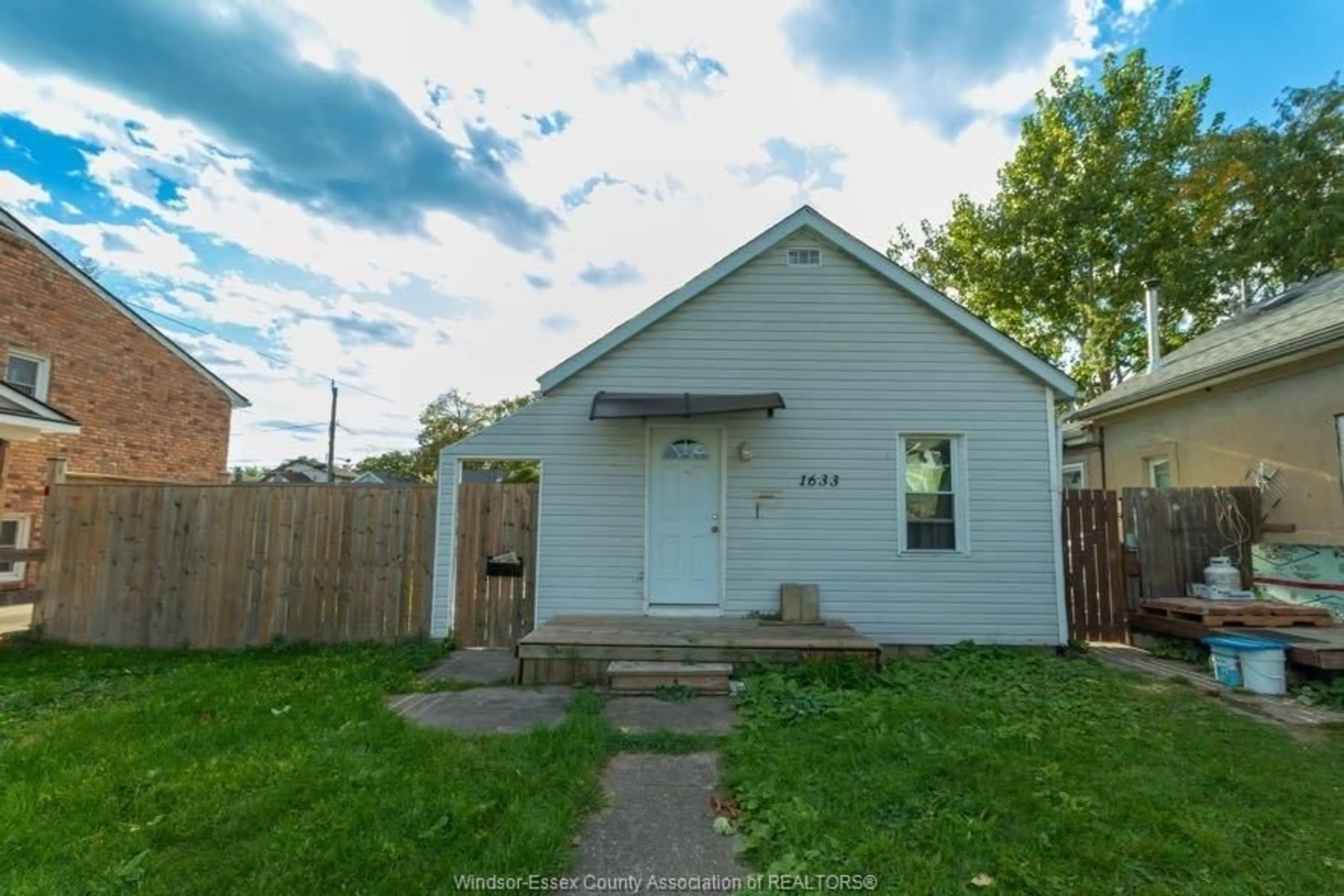 Frontside or backside of a home, the fenced backyard for 1633 PARENT, Windsor Ontario N8X 4J9