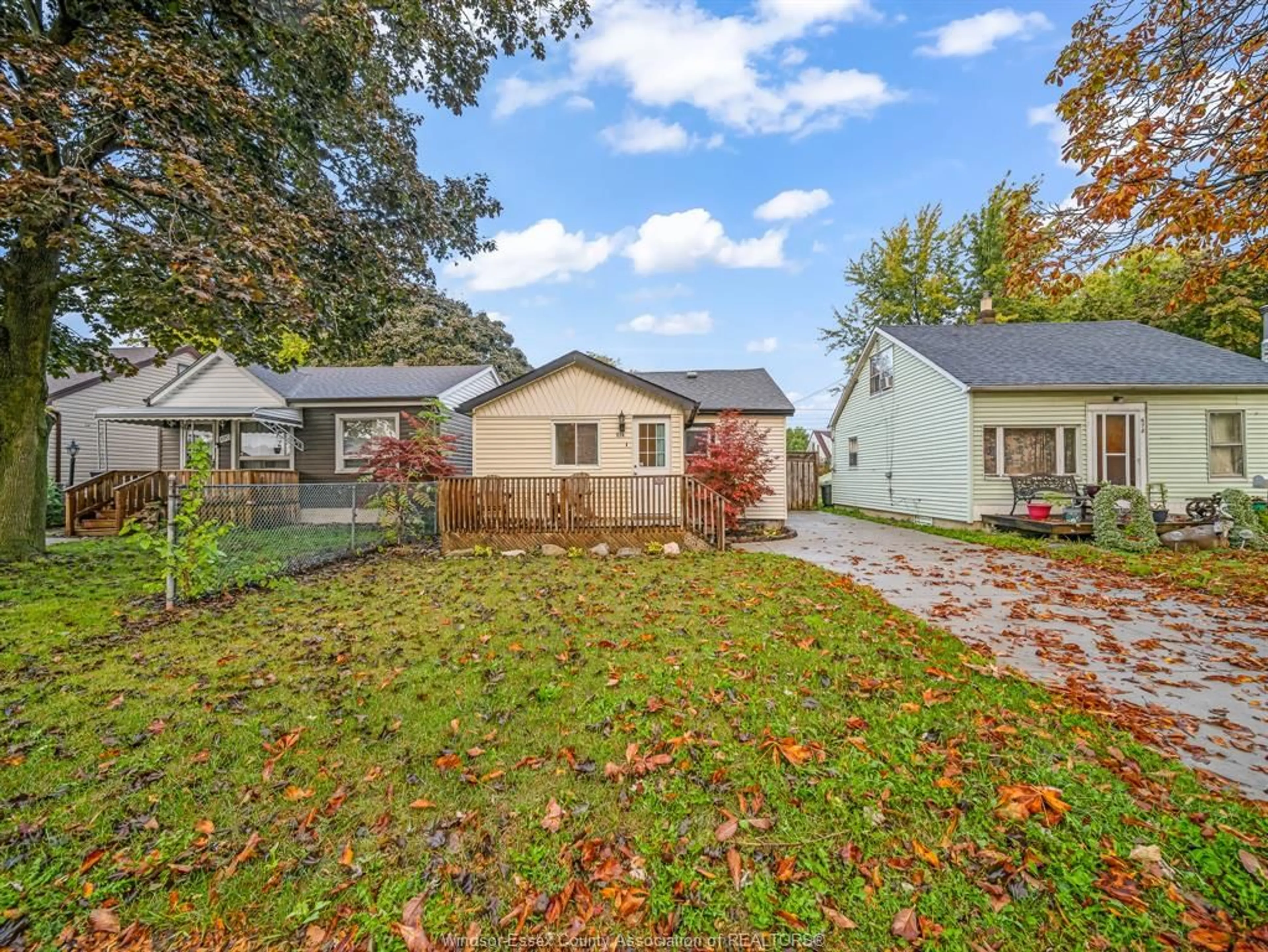 Frontside or backside of a home, the fenced backyard for 674 Eugenie St, Windsor Ontario N8X 3Y4