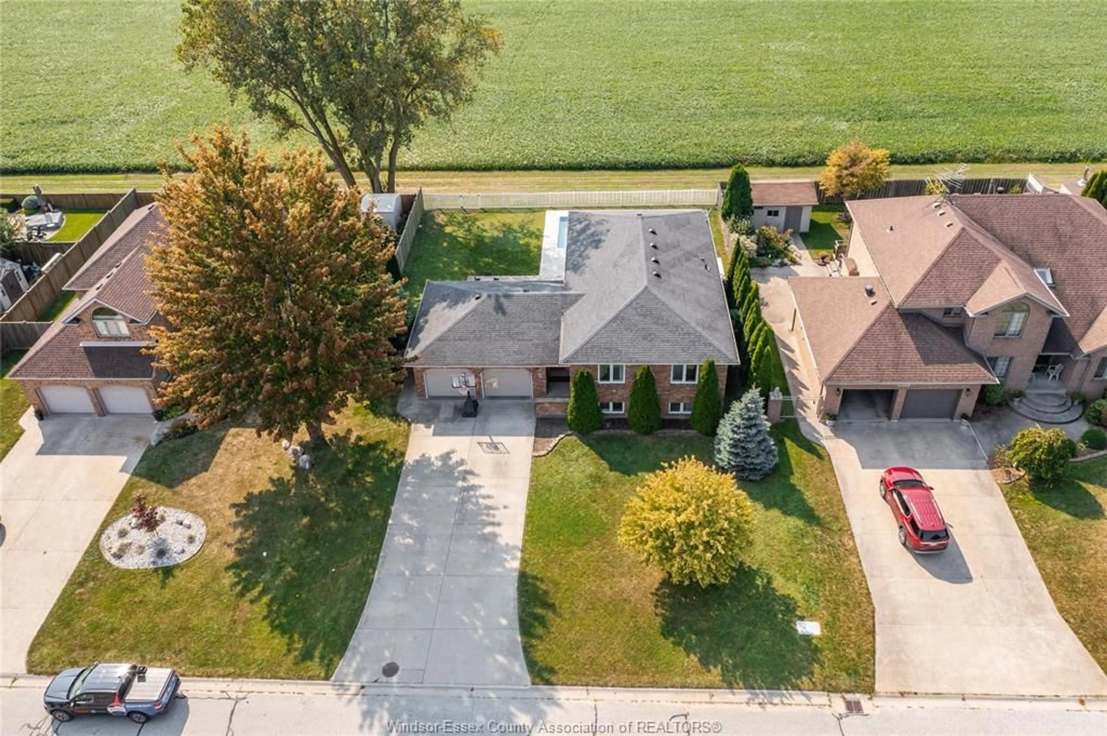 A pic from outside/outdoor area/front of a property/back of a property/a pic from drone, street for 2083 SHAWNEE Rd, Tecumseh Ontario N8N 4P6