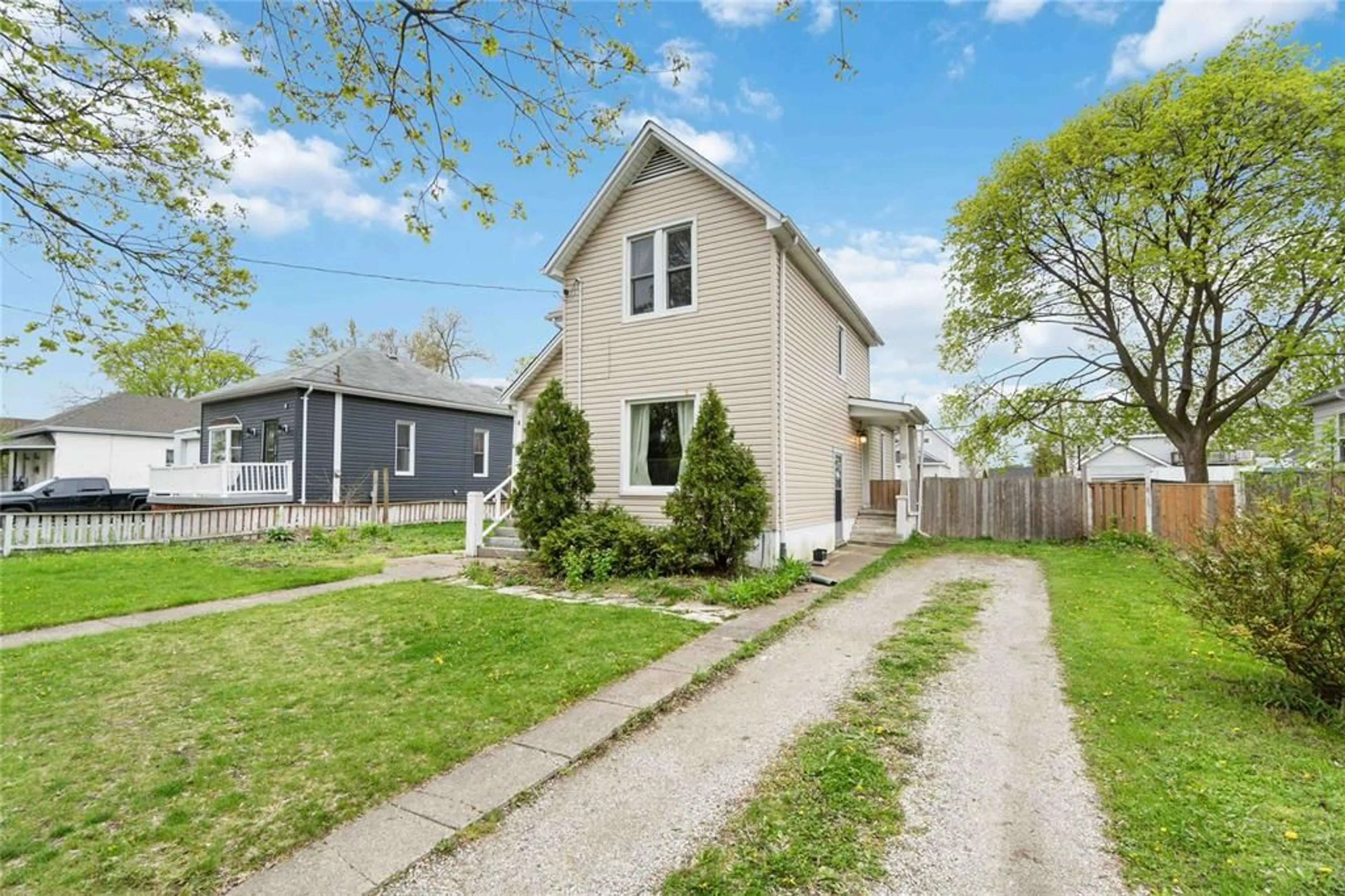 Frontside or backside of a home, the fenced backyard for 119 SAMUEL St, Sarnia Ontario N7T 2X5