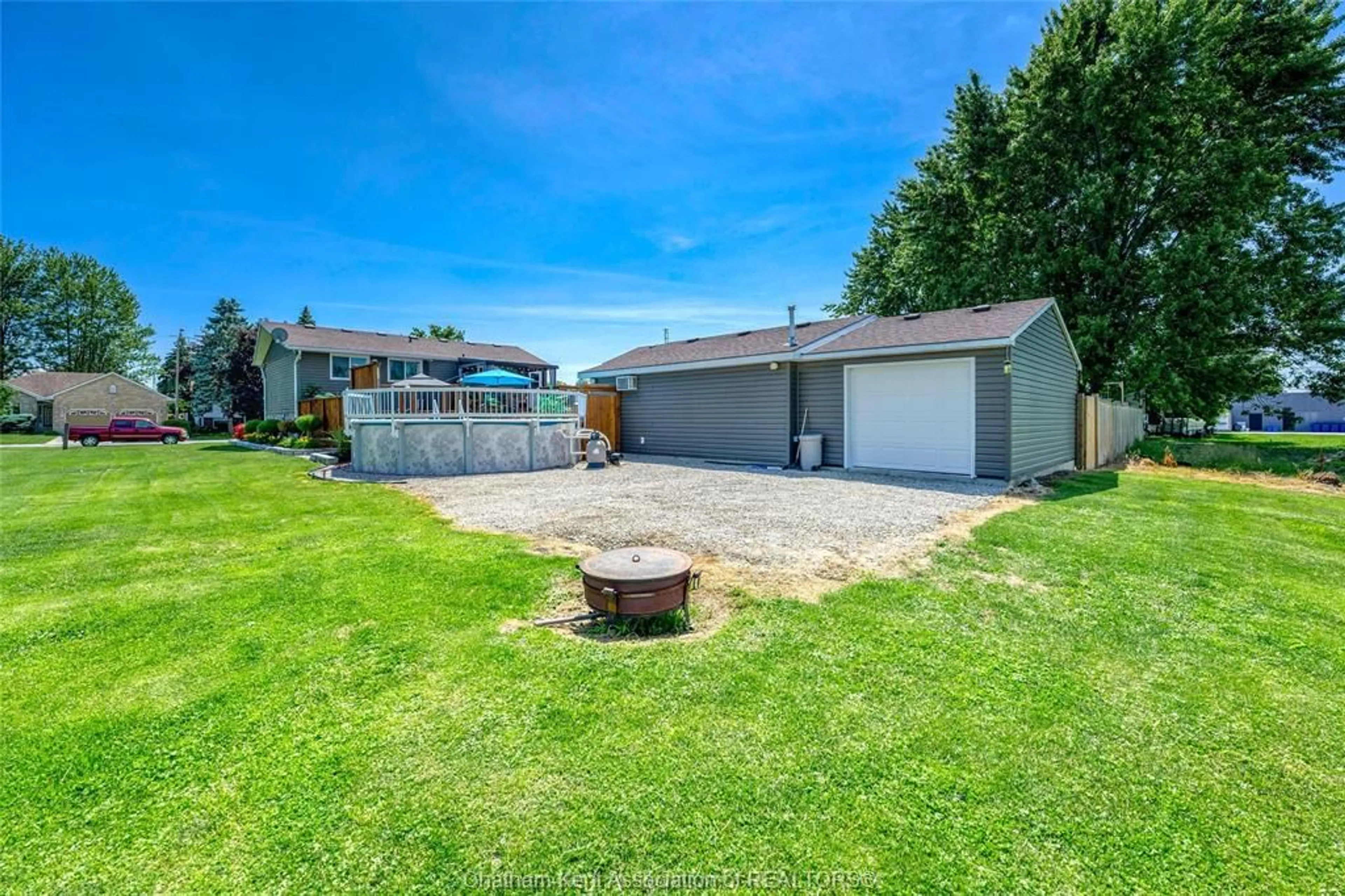 Frontside or backside of a home, the fenced backyard for 84 Duke St, Wallaceburg Ontario N8A 1E8