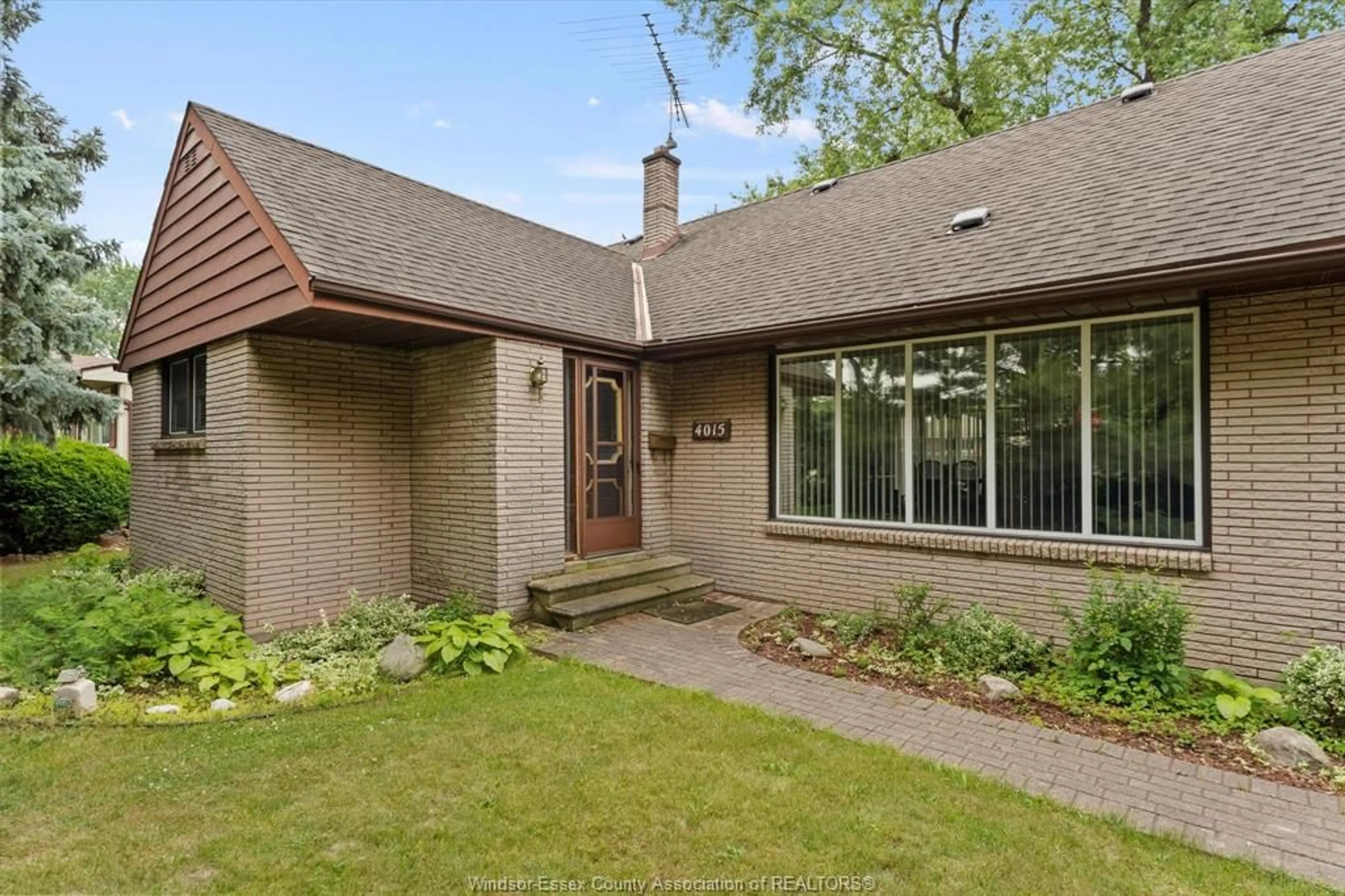 Home with brick exterior material for 4015 DOUGALL Ave, Windsor Ontario N9G 1X4