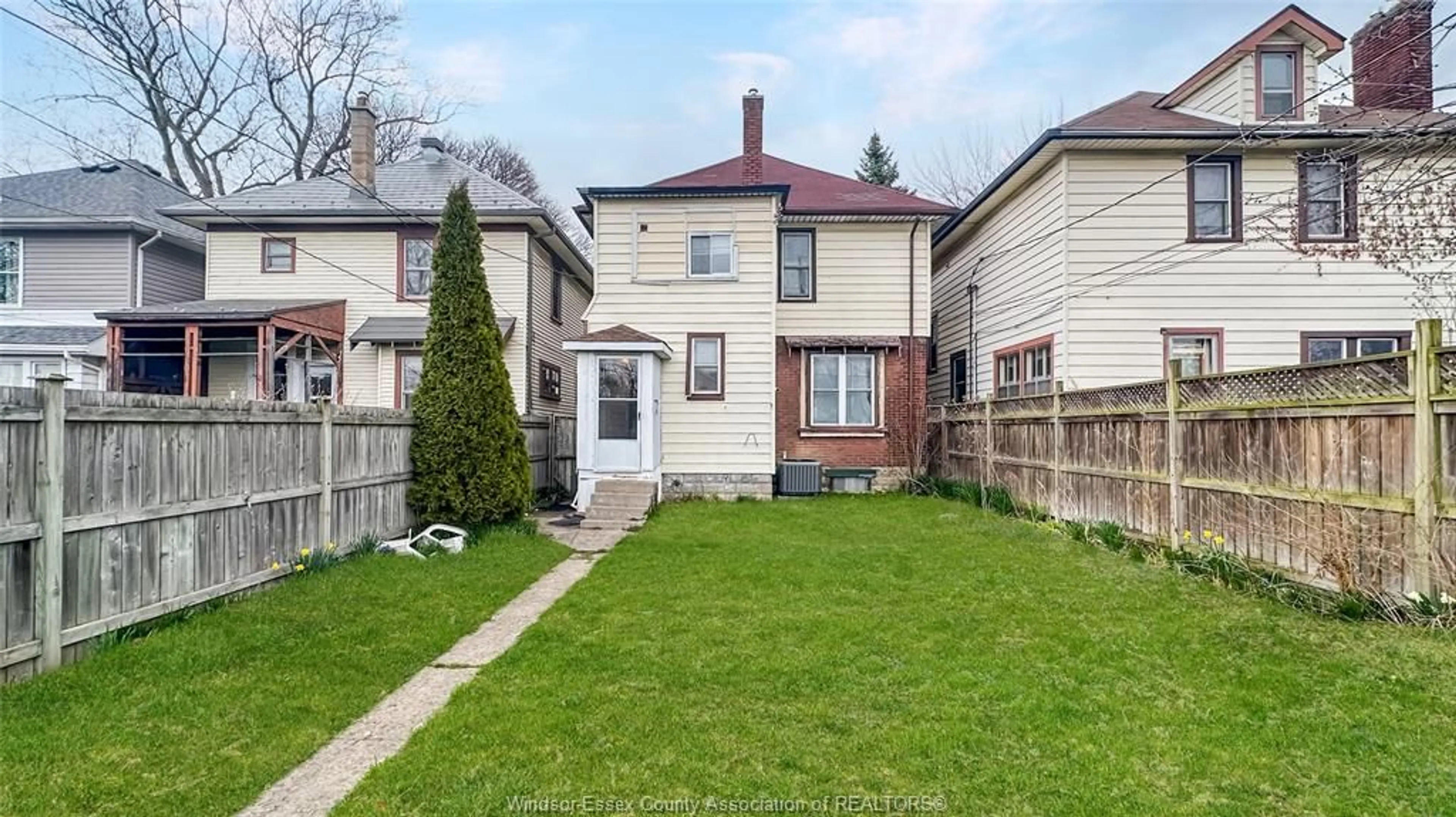 Frontside or backside of a home, the fenced backyard for 473 ELM, Windsor Ontario N9A 5H2