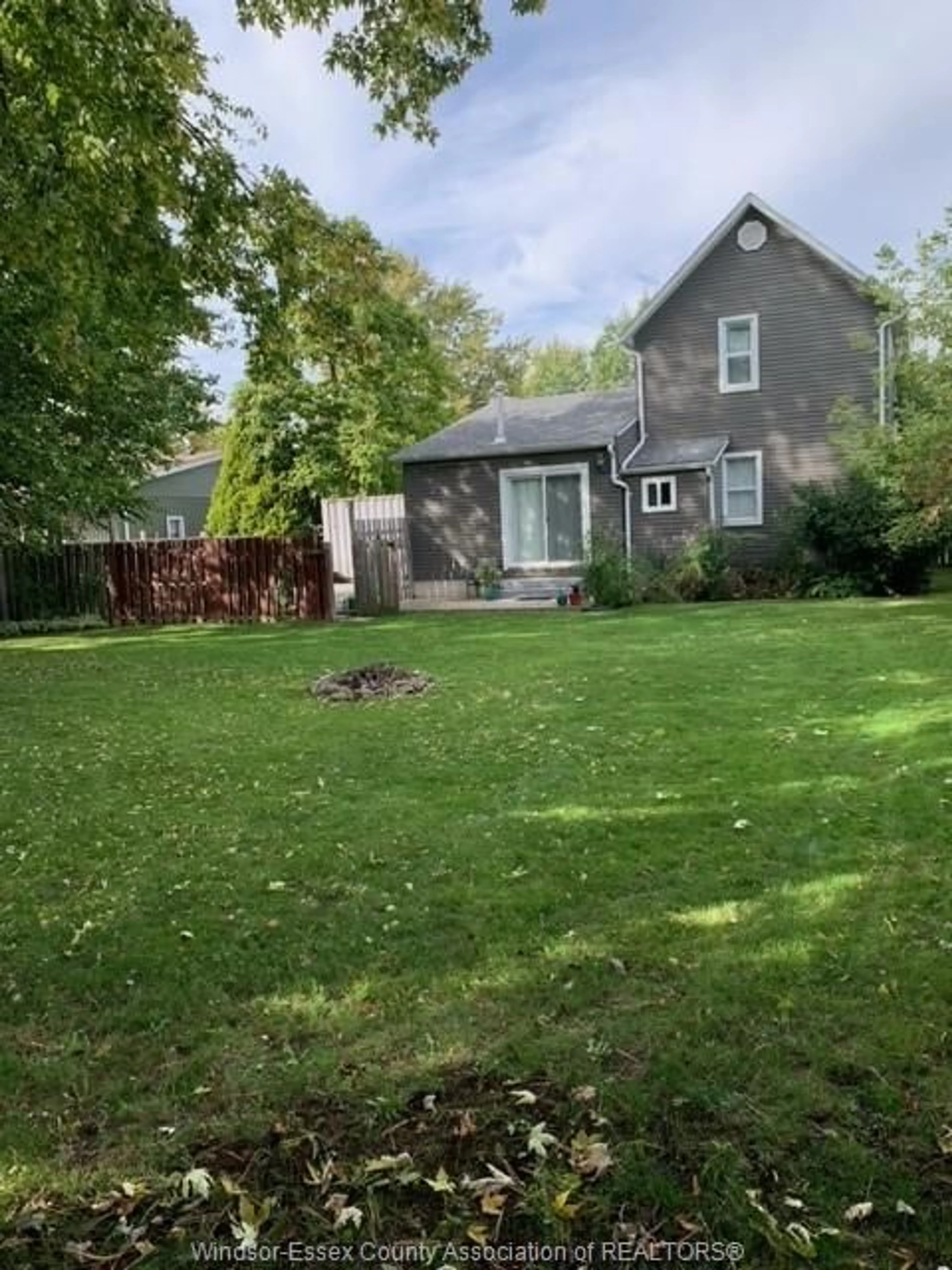 Frontside or backside of a home, the fenced backyard for 319 LINDSLEY St, Dresden Ontario N0P 1M0