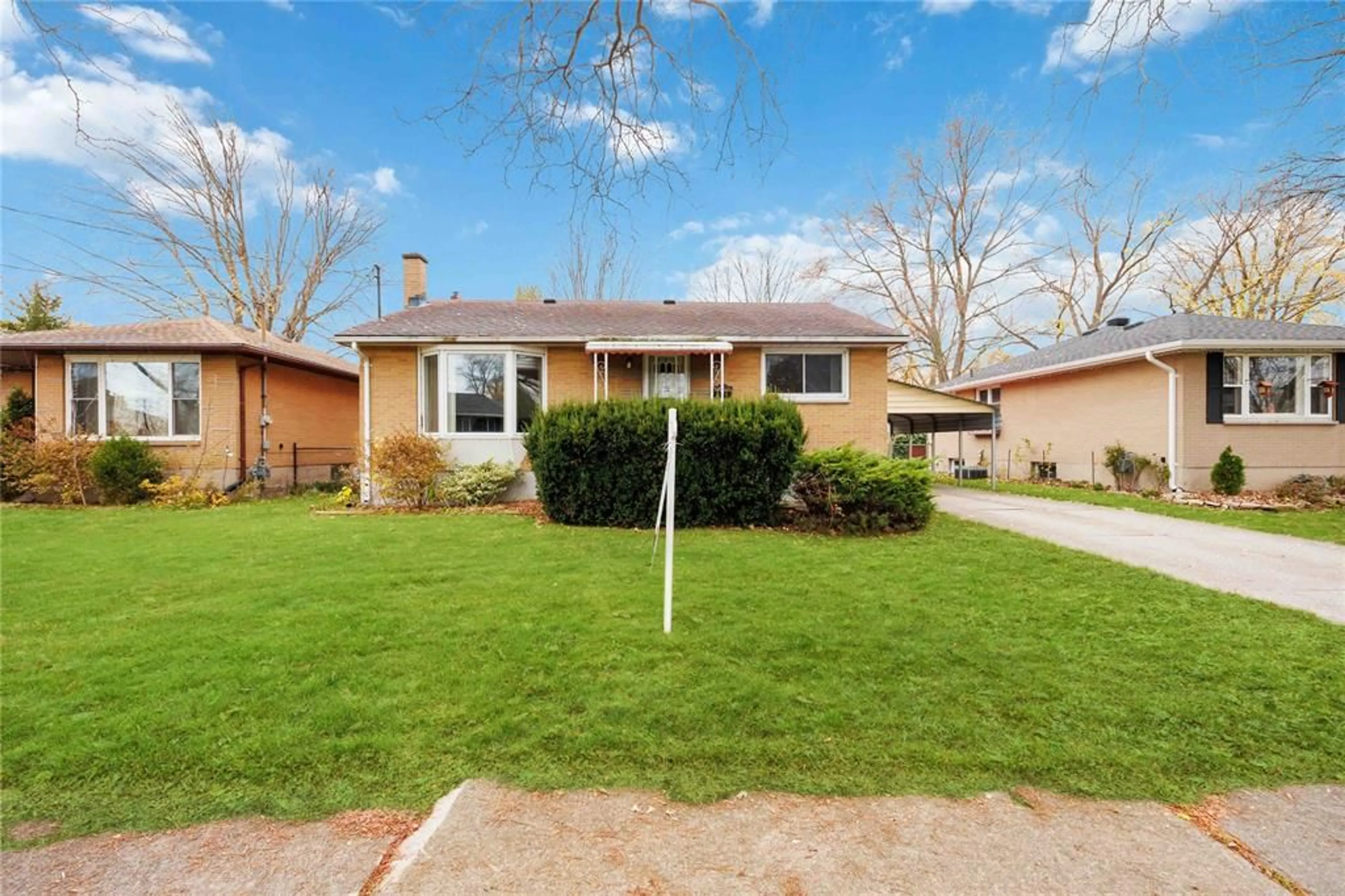 Frontside or backside of a home, the fenced backyard for 931 OAK Ave, Sarnia Ontario N7S1J2