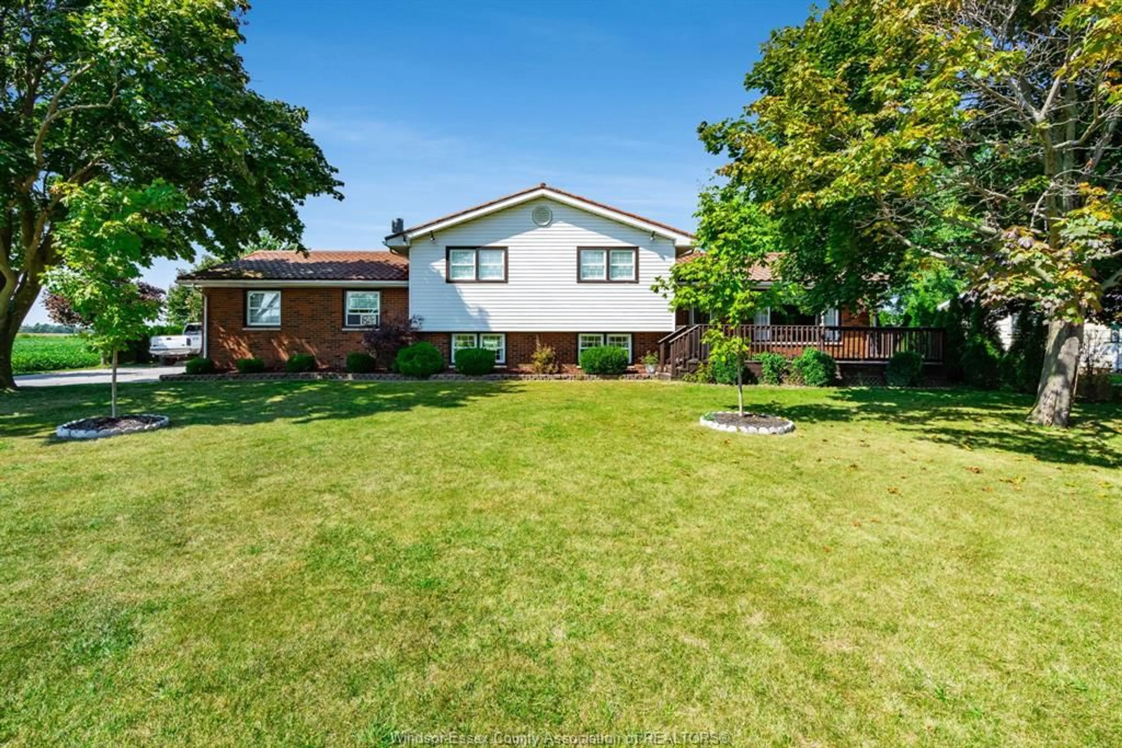 Frontside or backside of a home, the fenced backyard for 971 Talbot Trail, Wheatley Ontario N0P 2P0