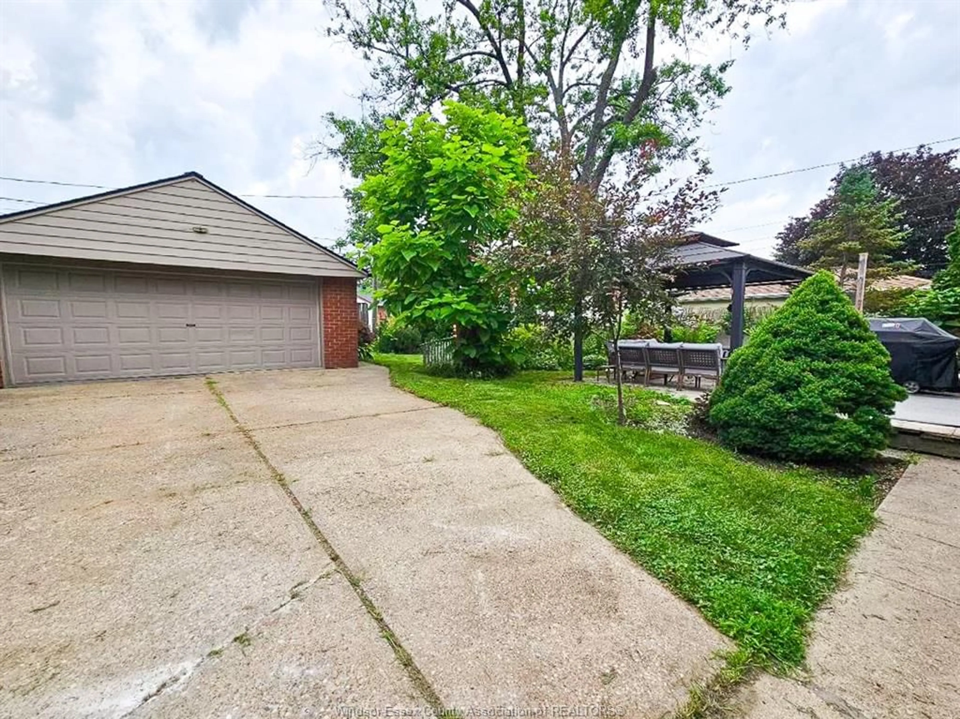 Frontside or backside of a home, the fenced backyard for 2845 VIRGINIA PARK, Windsor Ontario N9E 2B8