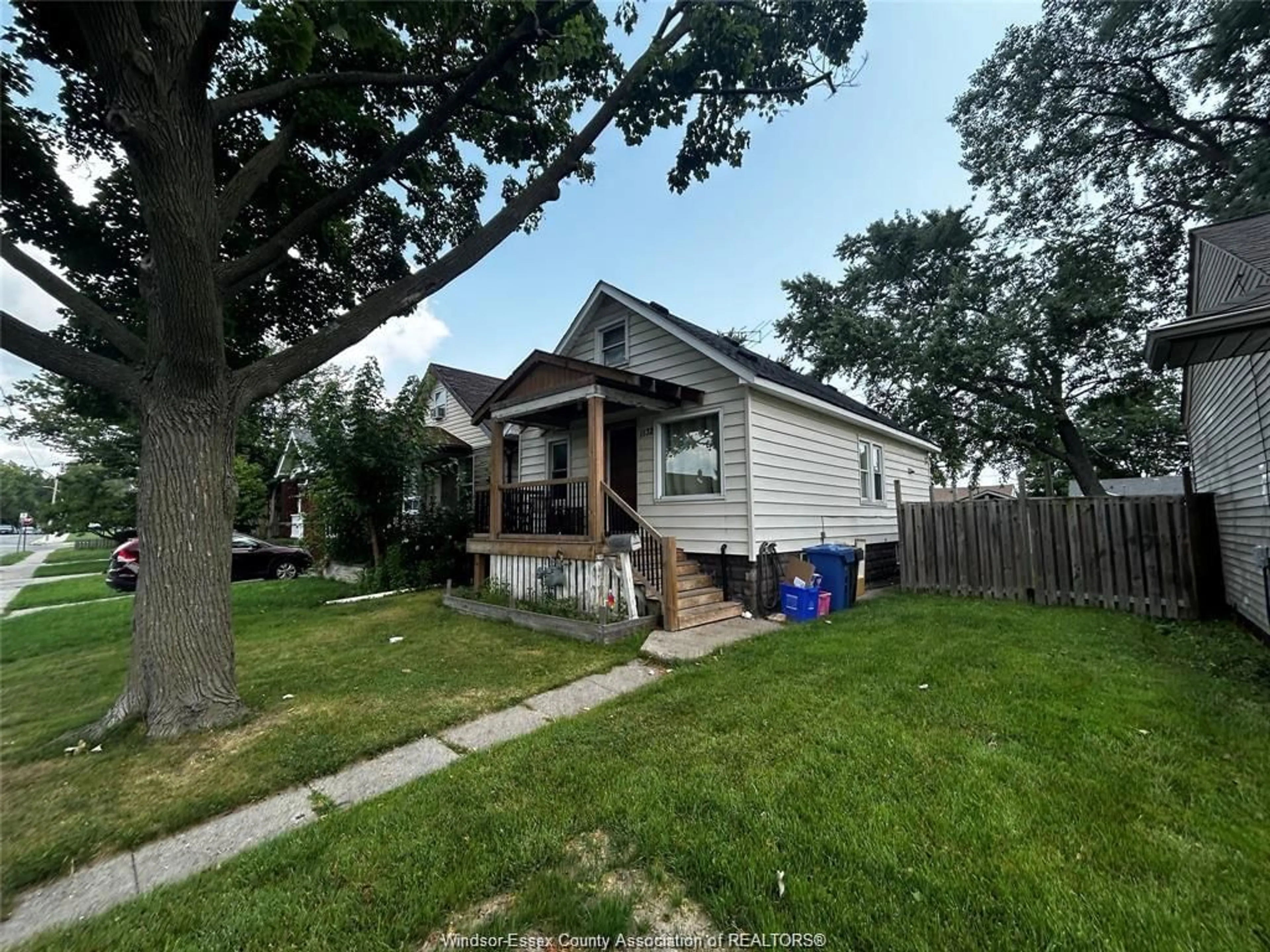 Frontside or backside of a home, the fenced backyard for 1132 CURRY Ave, Windsor Ontario N9B 2C9