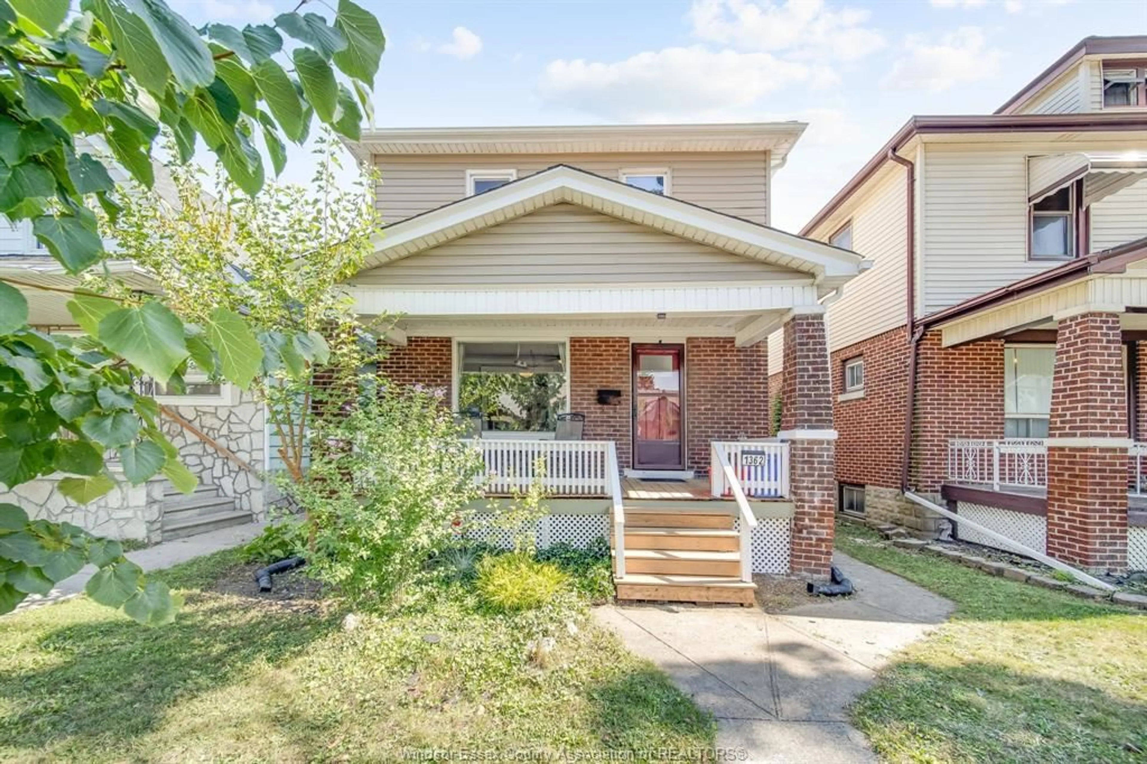 Frontside or backside of a home, the fenced backyard for 1362 HALL Ave, Windsor Ontario N8X 4R3