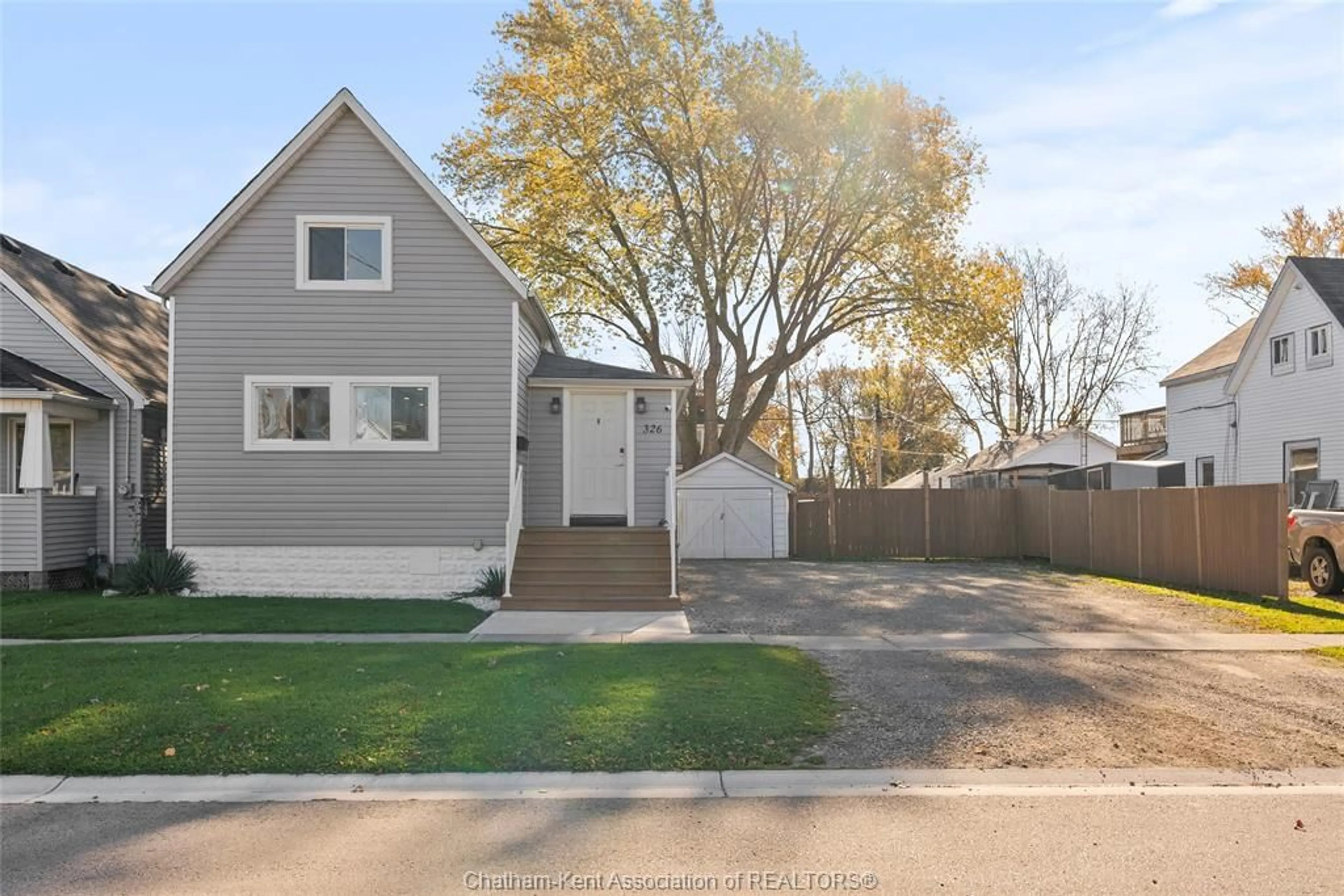 Frontside or backside of a home, the fenced backyard for 326 Wallace St, Wallaceburg Ontario N8A 1M4