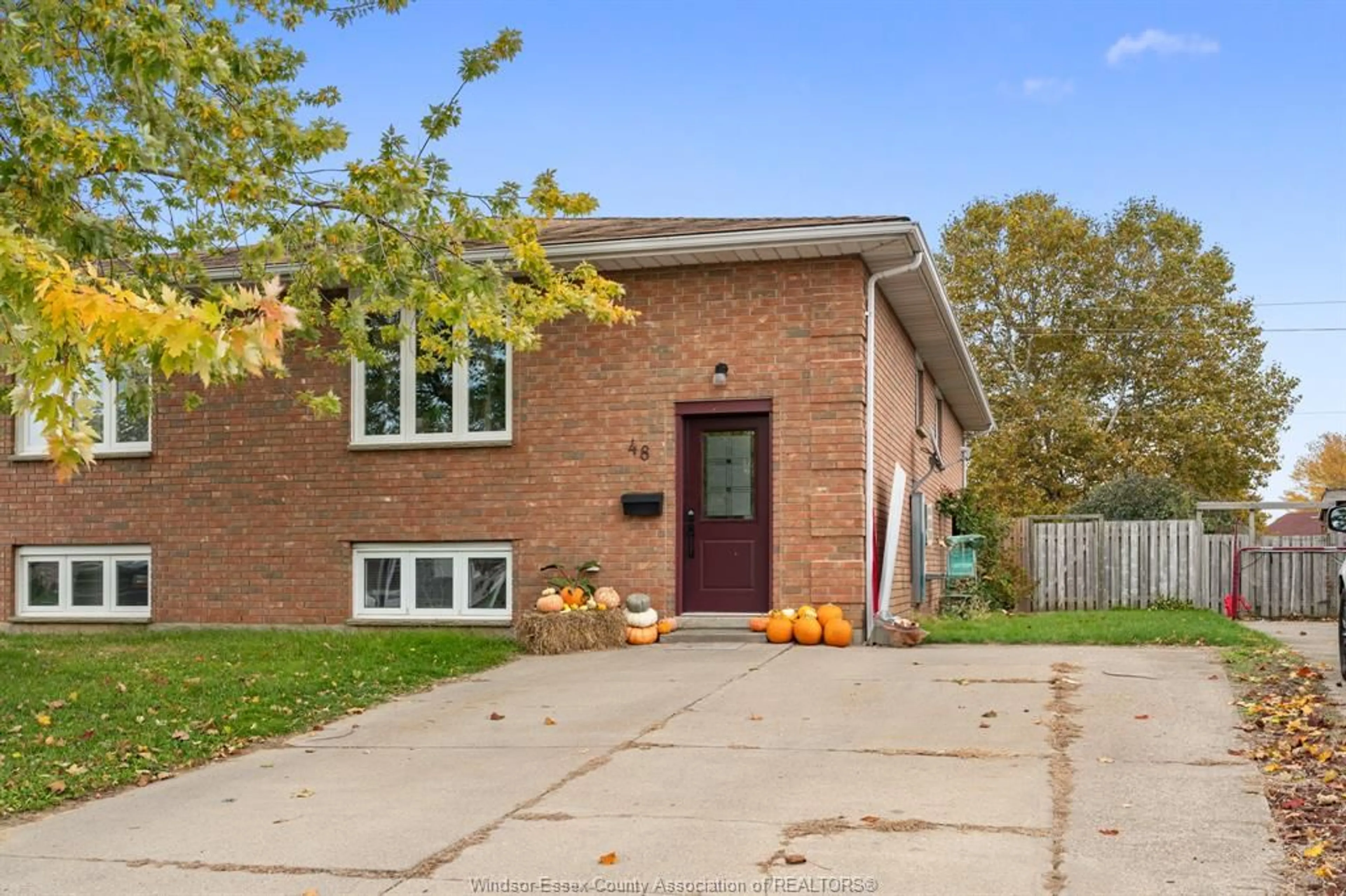 Home with brick exterior material for 48 Sutton Dr., Leamington Ontario N8H 5C8