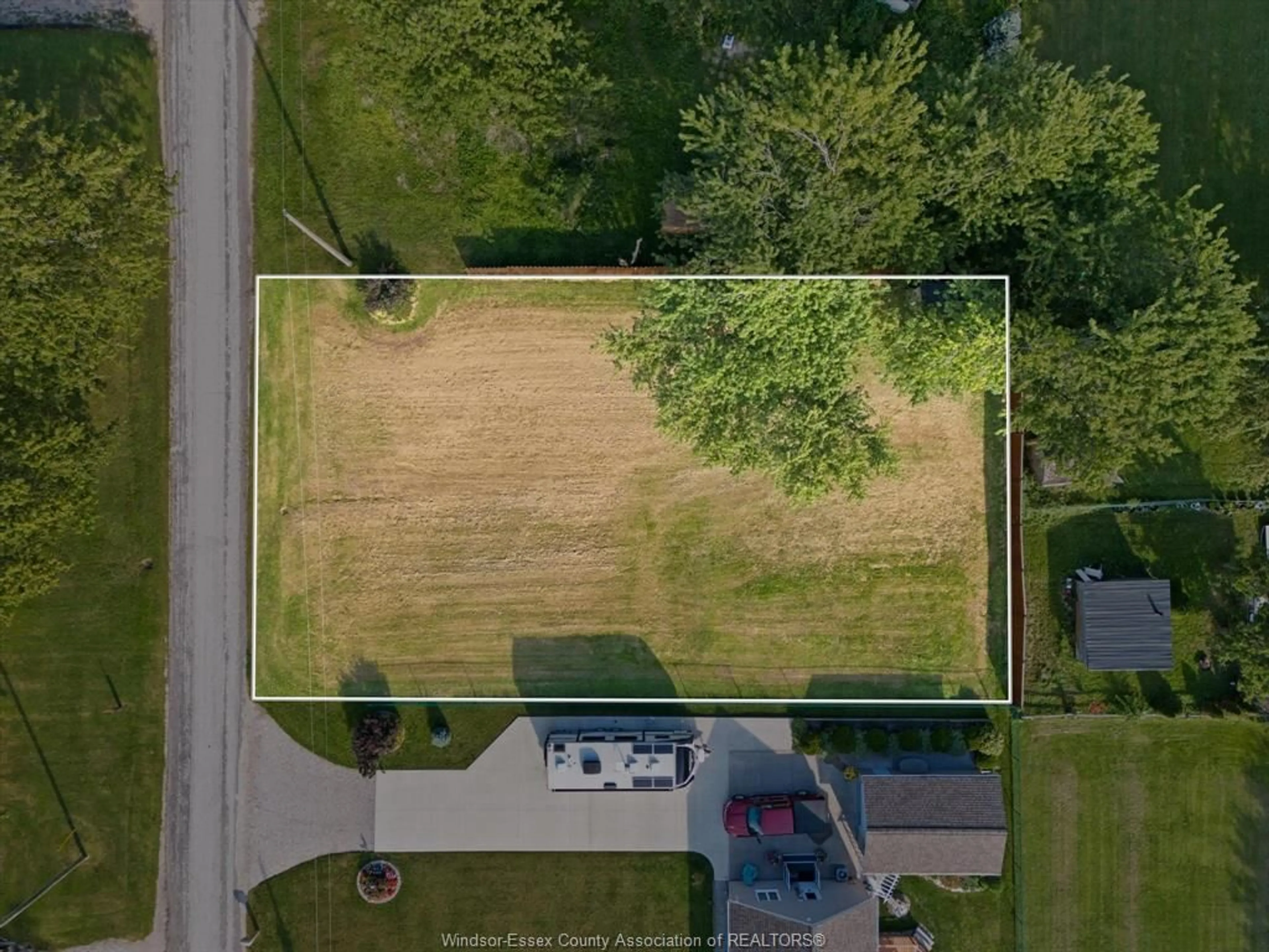 Frontside or backside of a home, the fenced backyard for 18 Marentette Ave, Leamington Ontario N0P 2P0