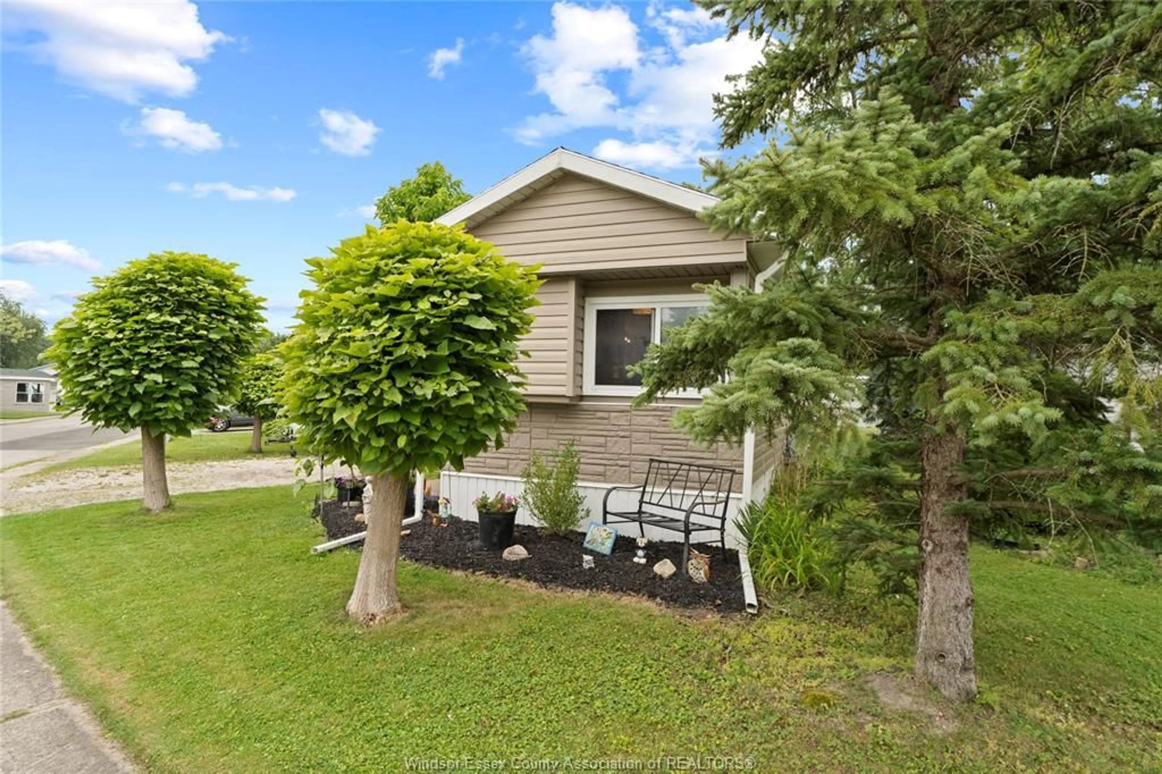 Frontside or backside of a home, the fenced backyard for 323 BEVERLY, Essex Ontario N8M 2C1