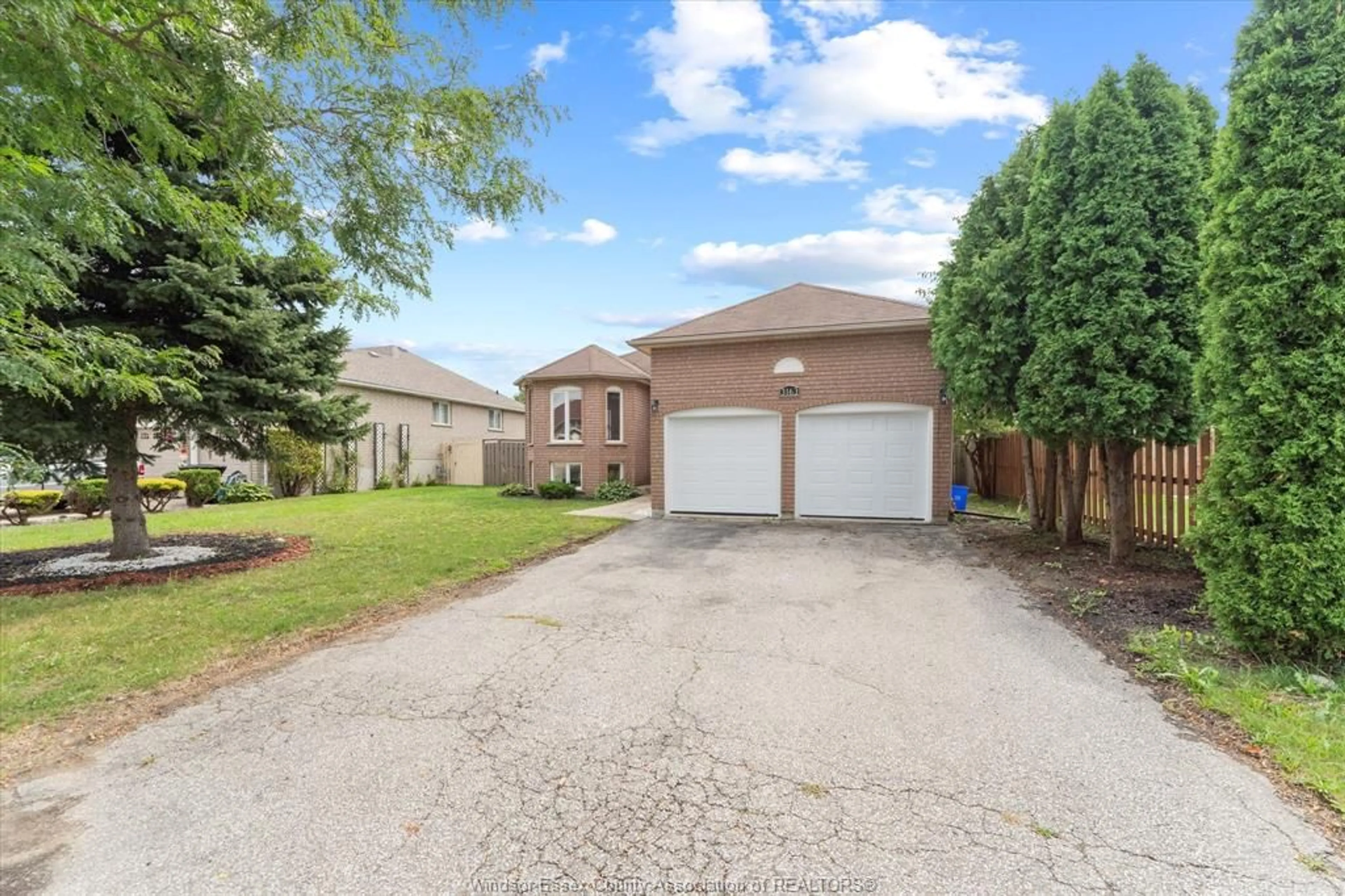 Frontside or backside of a home, the fenced backyard for 3163 FLETCHER Cres, Windsor Ontario N9E 4M8