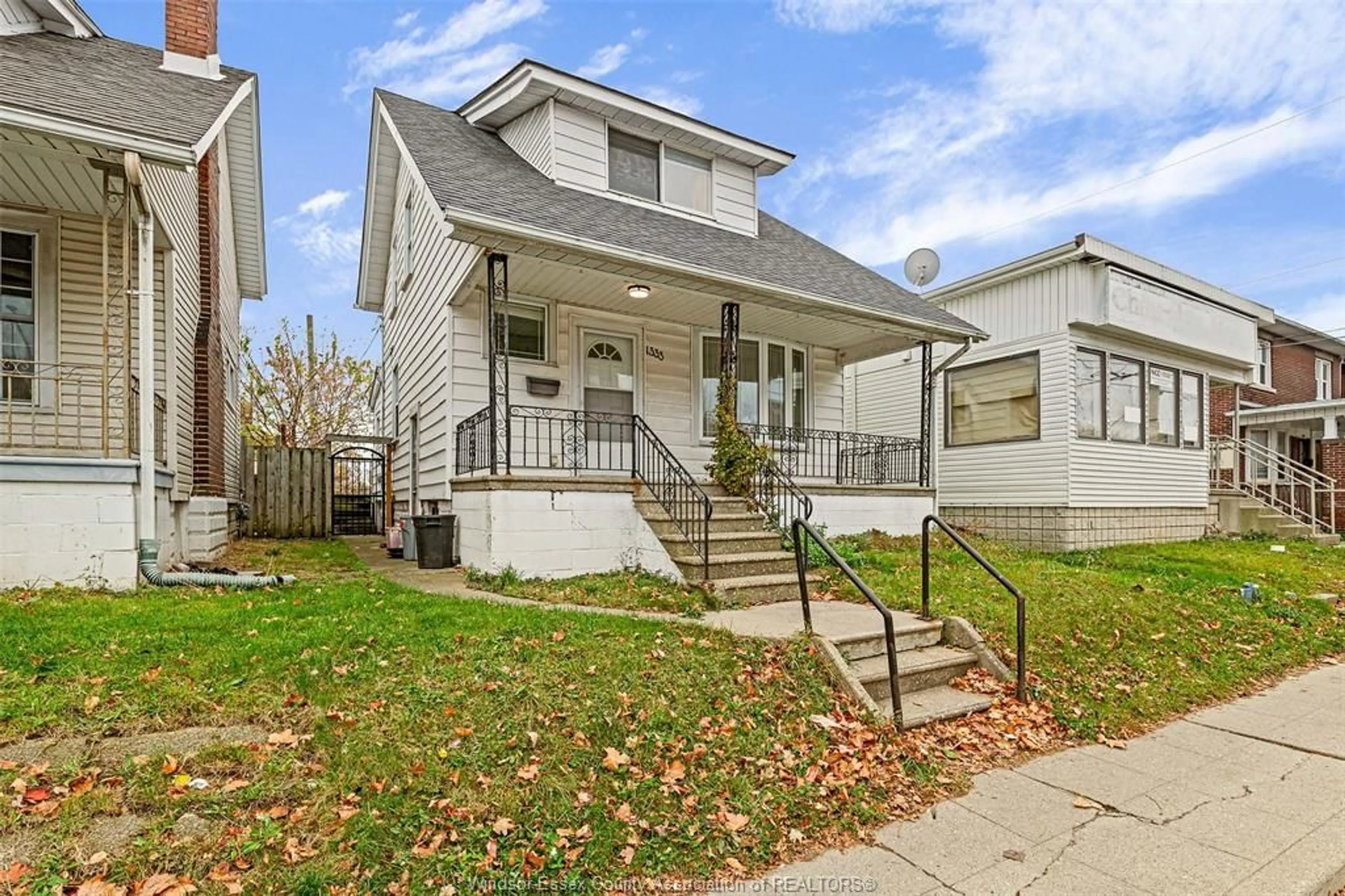 Frontside or backside of a home, the fenced backyard for 1333 WYANDOTTE STREET, Windsor Ontario N9B 1H3