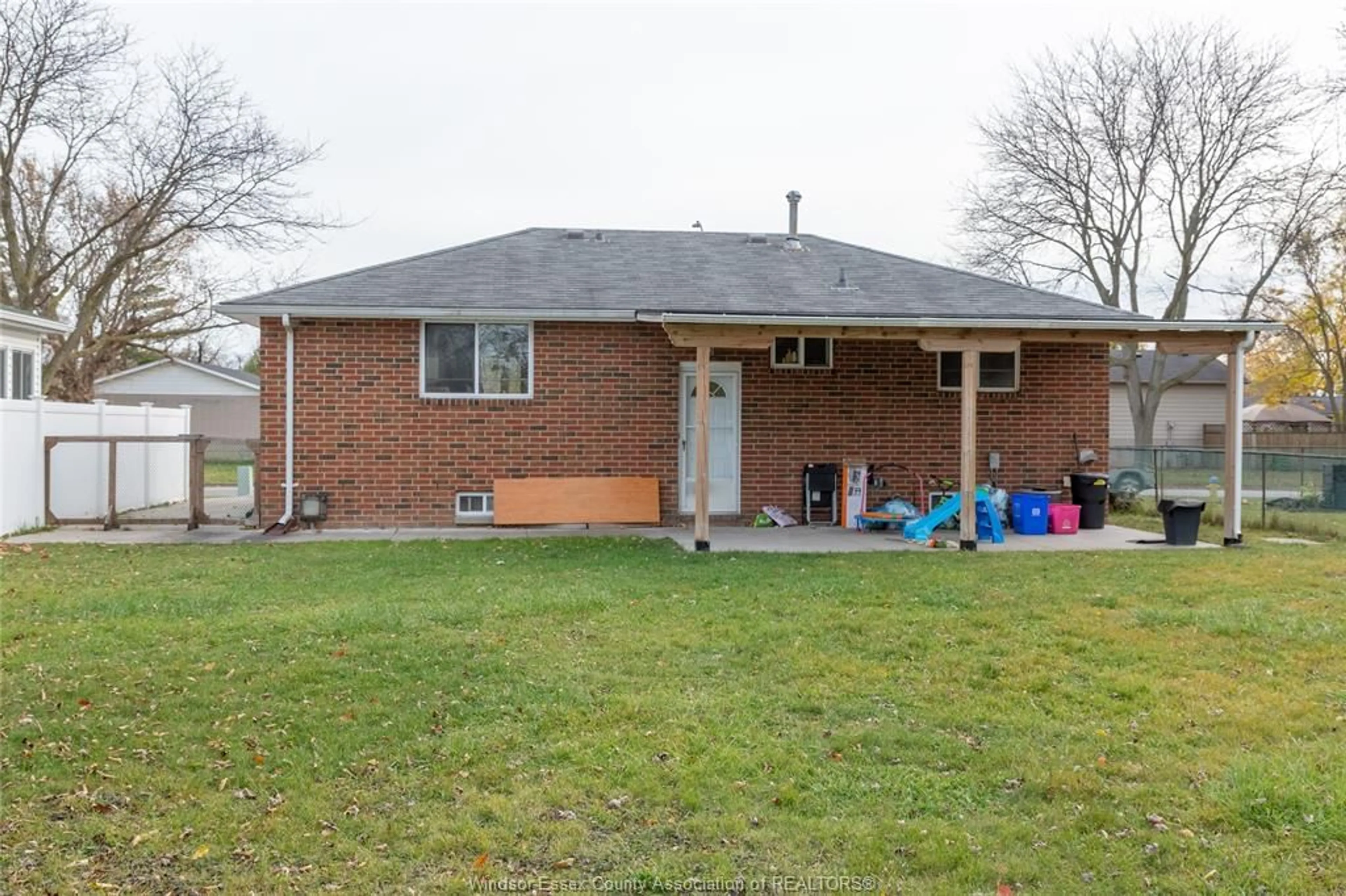 Frontside or backside of a home, the fenced backyard for 5210 QUEEN ELIZABETH, Windsor Ontario N8T 1N3