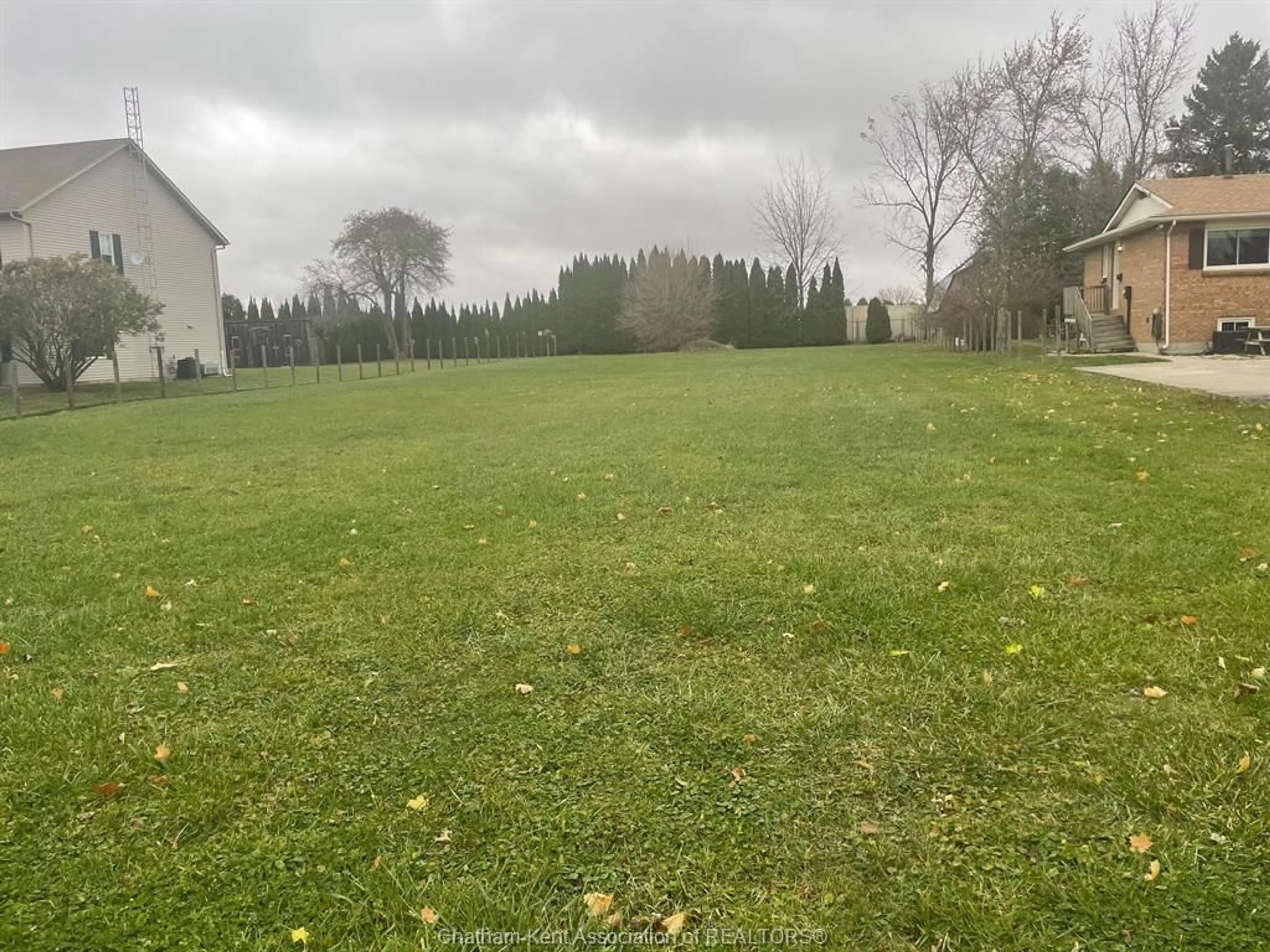 Frontside or backside of a home, the fenced backyard for 7407 North  River Line, Wallaceburg Ontario N8A 4R4