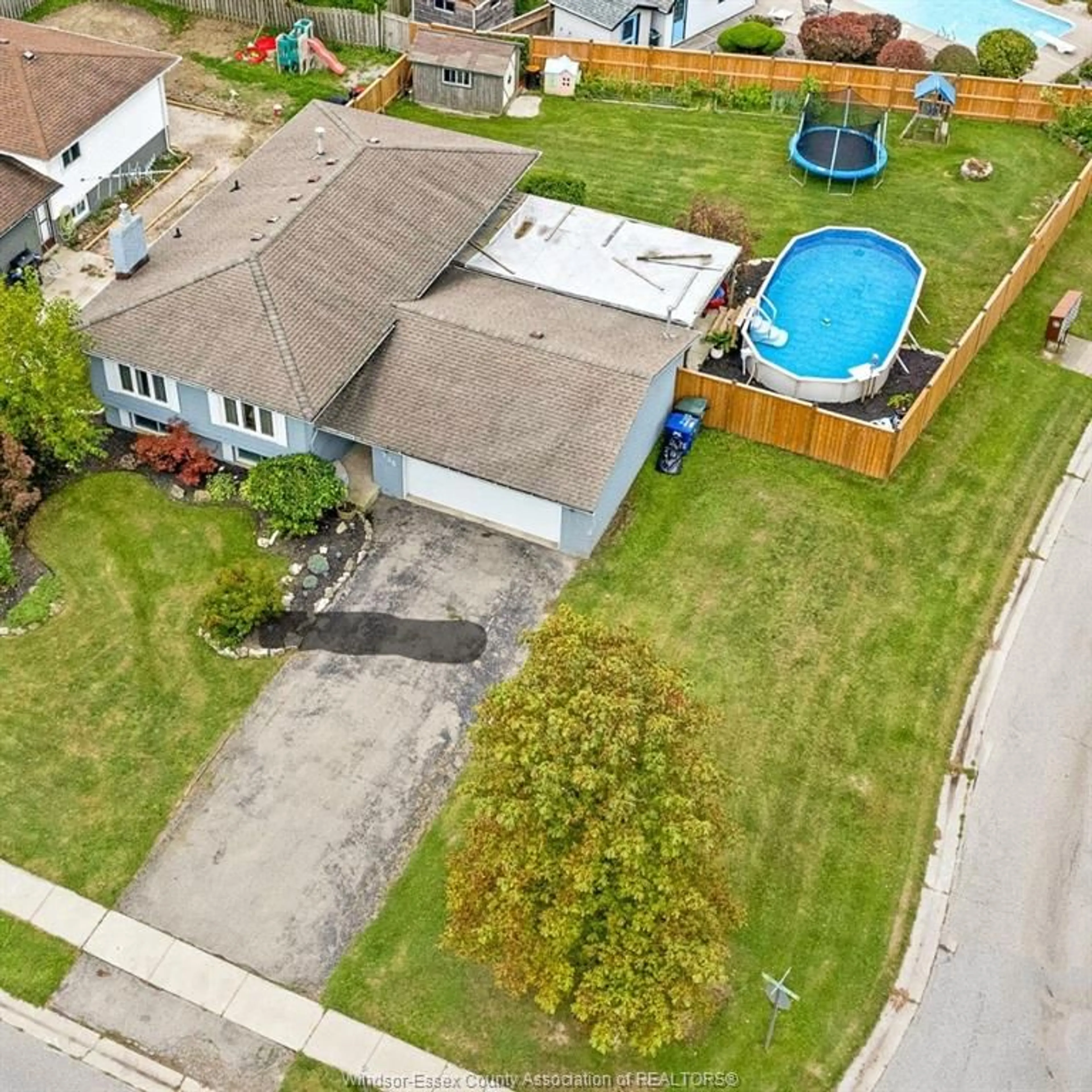 Frontside or backside of a home, the fenced backyard for 225 WILLOWWOOD Dr, Lakeshore Ontario N0R 1A0