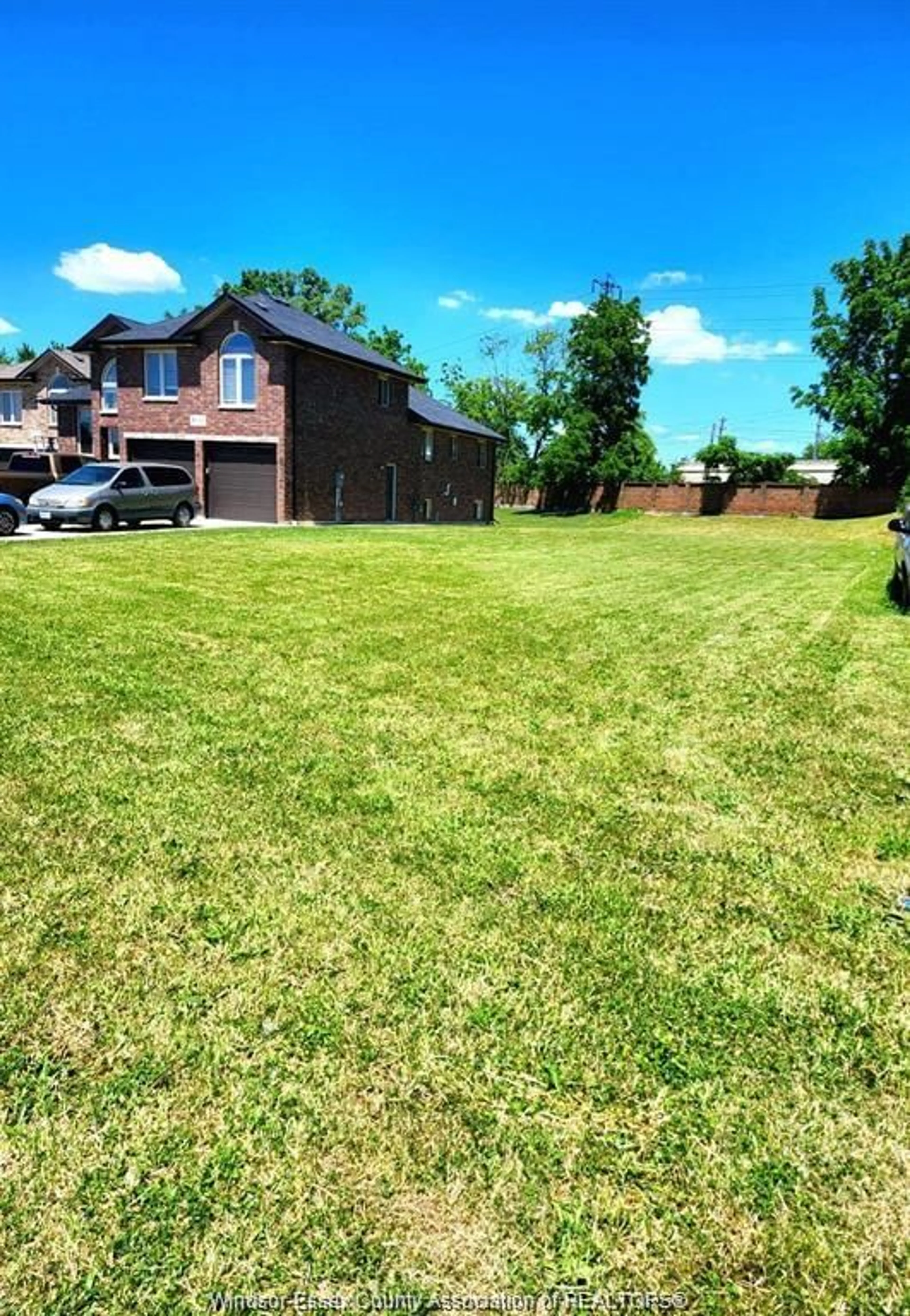 Frontside or backside of a home, the fenced backyard for V/L SOUTH PACIFIC, Windsor Ontario N9C 2W8