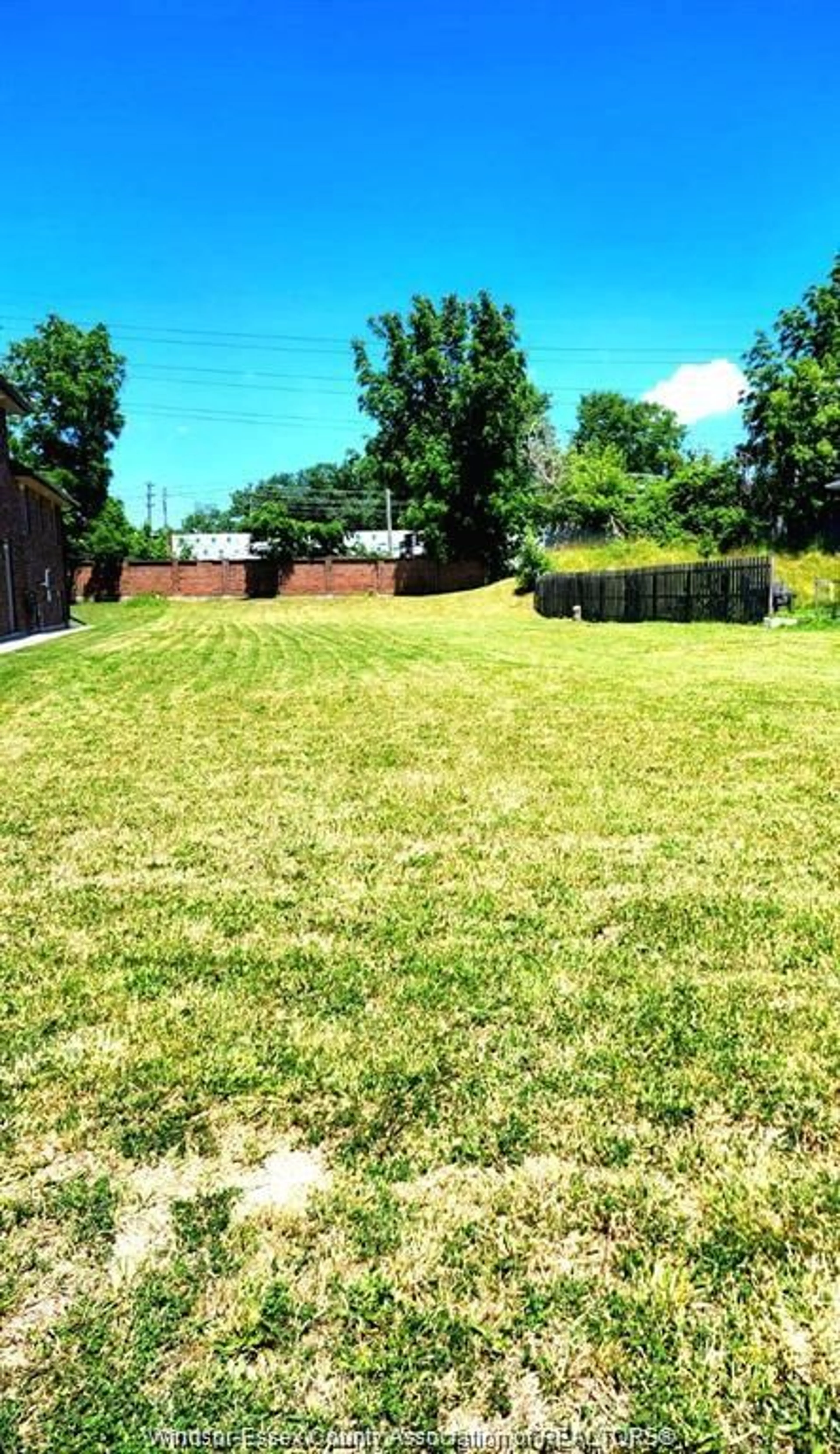 Frontside or backside of a home, the fenced backyard for V/L SOUTH PACIFIC, Windsor Ontario N9C 2W8