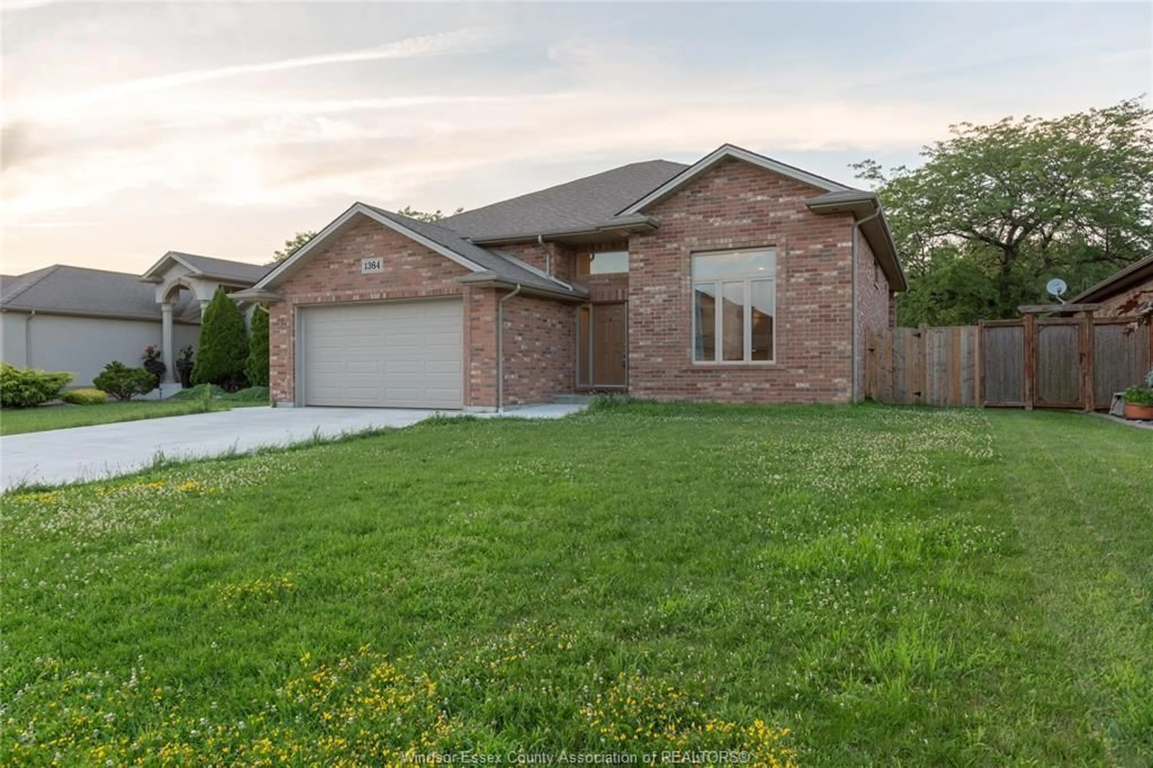 Frontside or backside of a home, the fenced backyard for 1364 Matthew Crescent, Lakeshore Ontario N0R 1A0