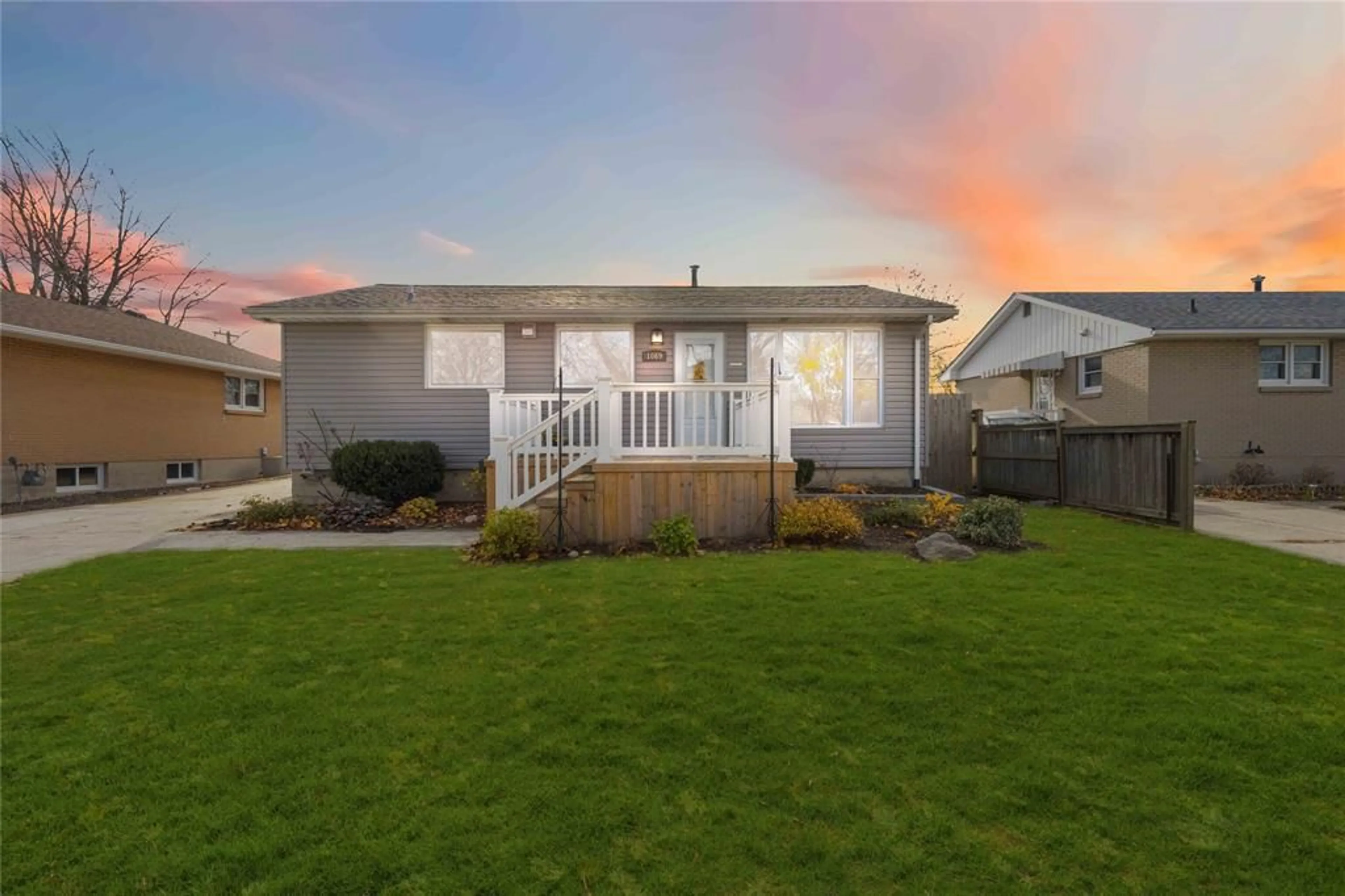 Frontside or backside of a home, the fenced backyard for 1069 CONNAUGHT Cres, Sarnia Ontario N7S 1C7