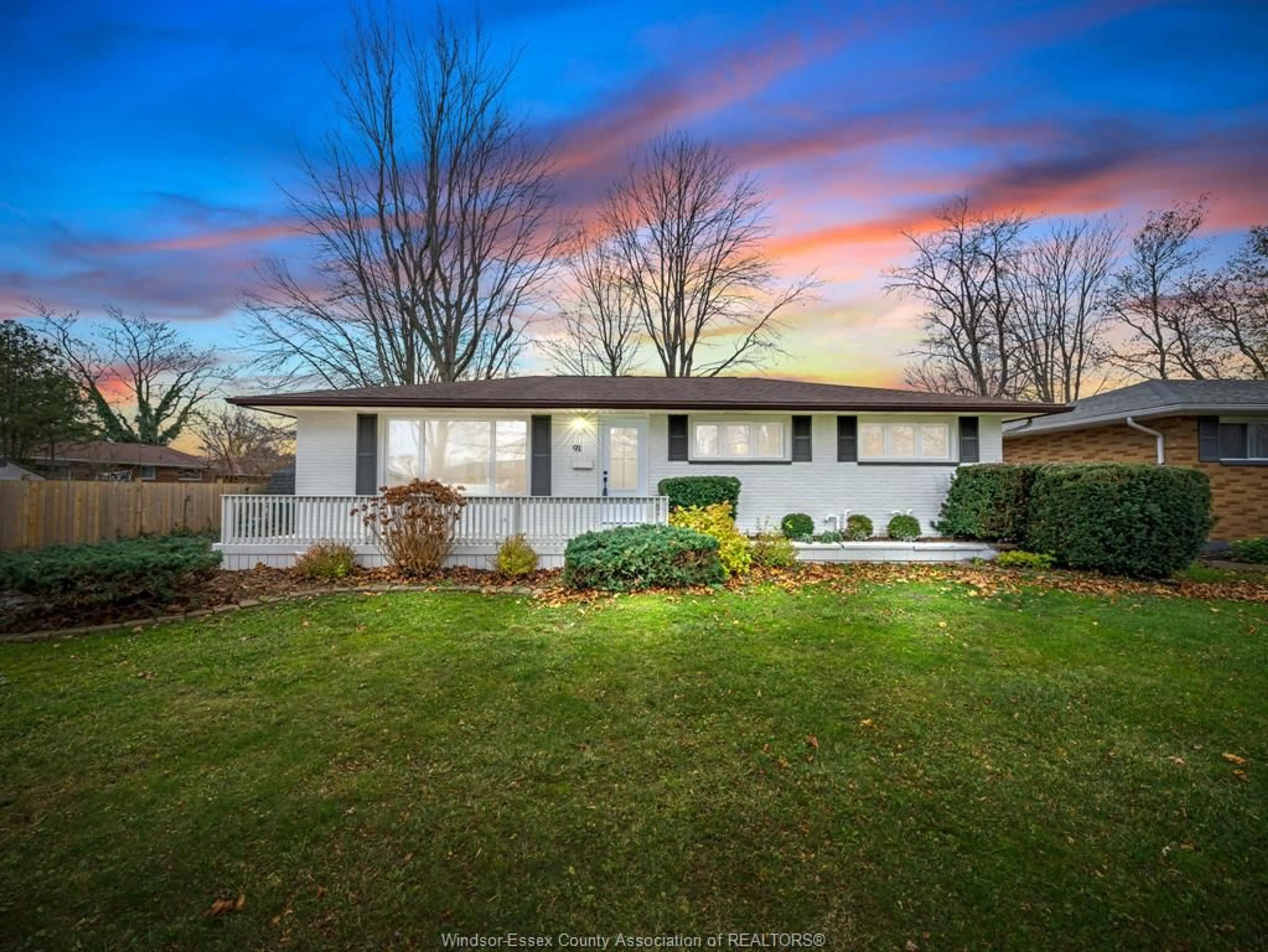 Frontside or backside of a home, the fenced backyard for 91 Woodlawn, Kingsville Ontario N9Y 1Y7