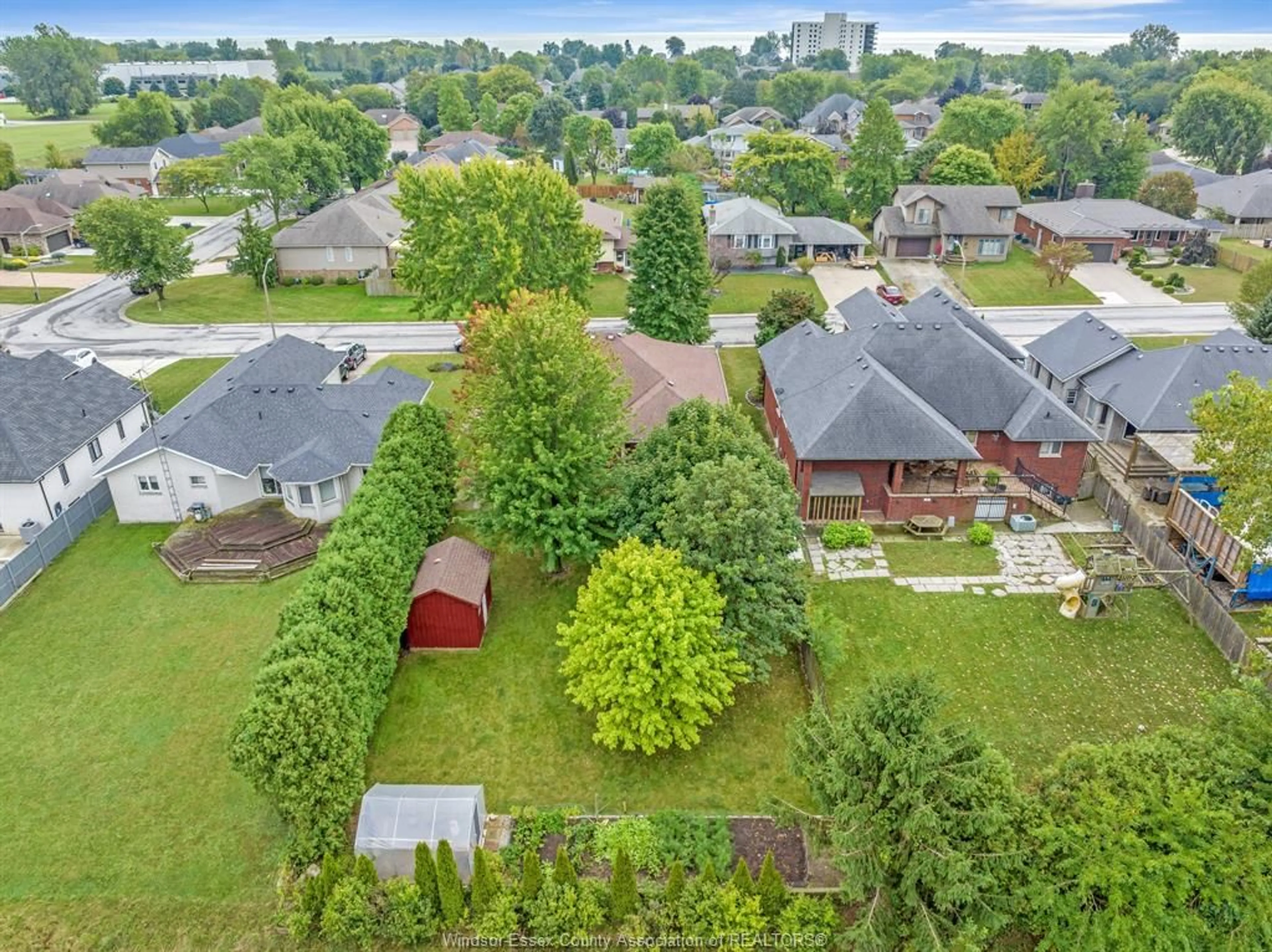 Frontside or backside of a home, the fenced backyard for 18 SHAWNEE Crt, Leamington Ontario N8H 5A8