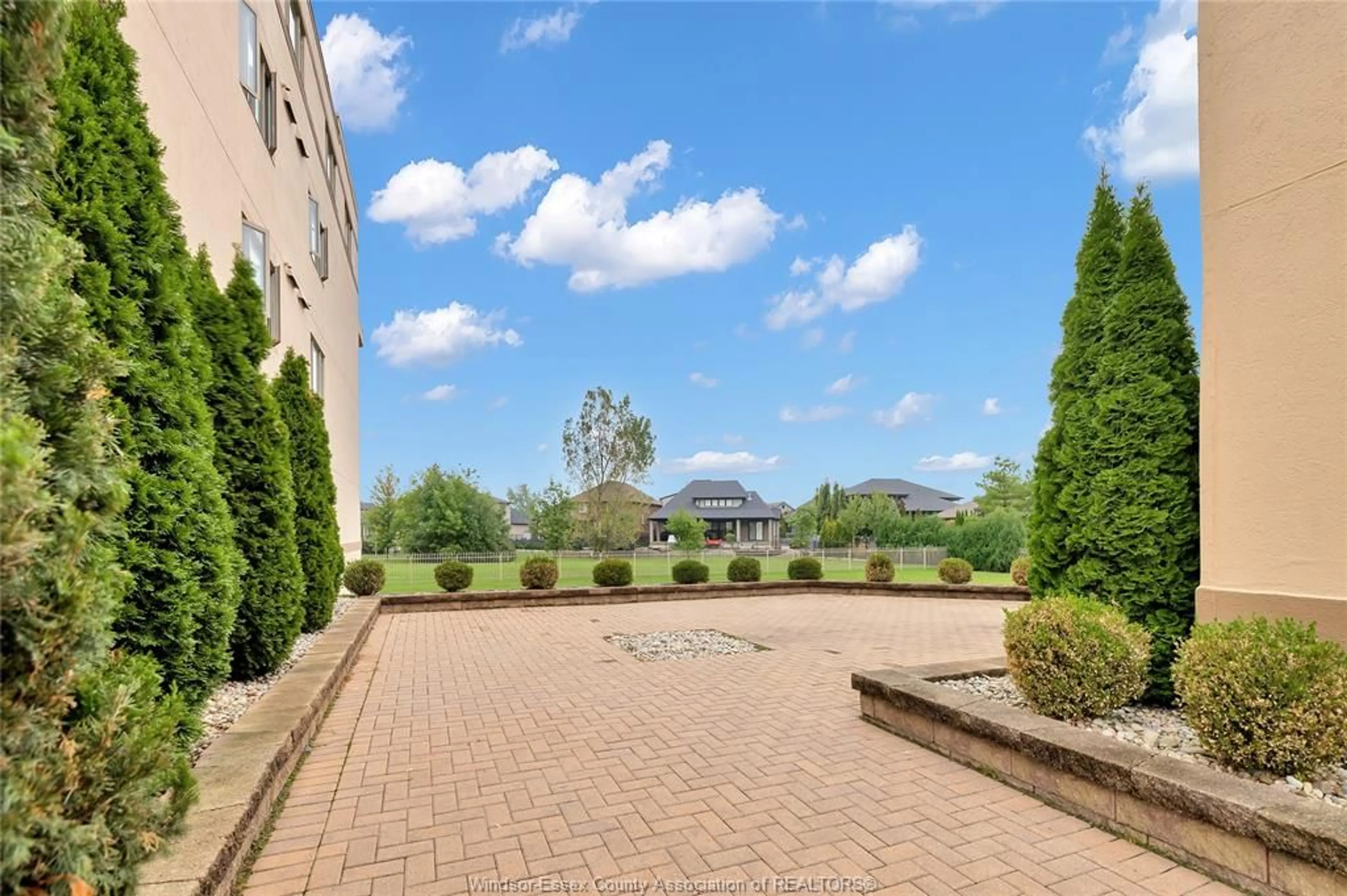 Patio, the front or back of building for 310 VILLAGE GROVE #210B, Tecumseh Ontario N8N 4X7