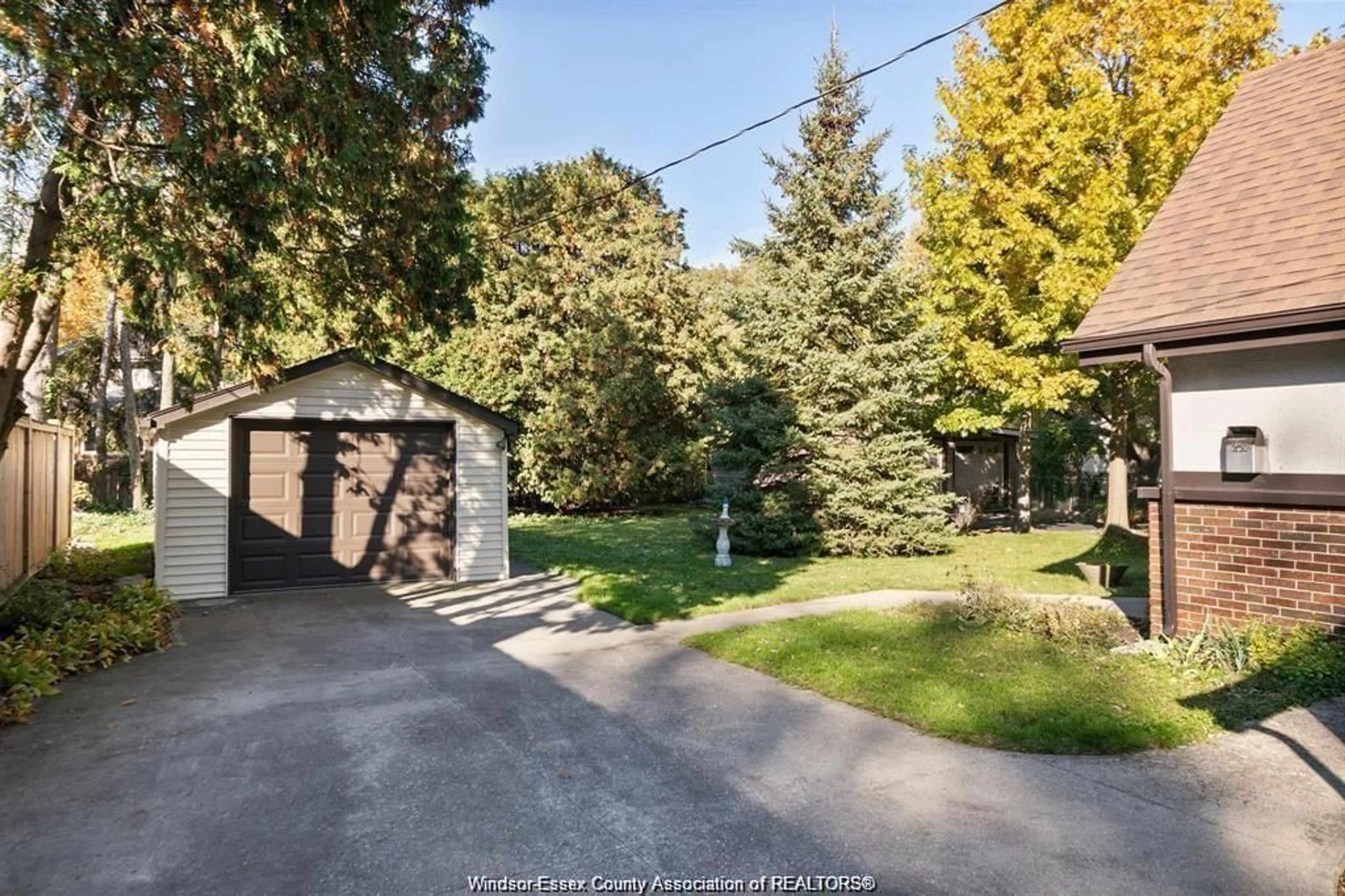 Frontside or backside of a home, the fenced backyard for 115 KENSINGTON Blvd, Tecumseh Ontario N8N 2K8